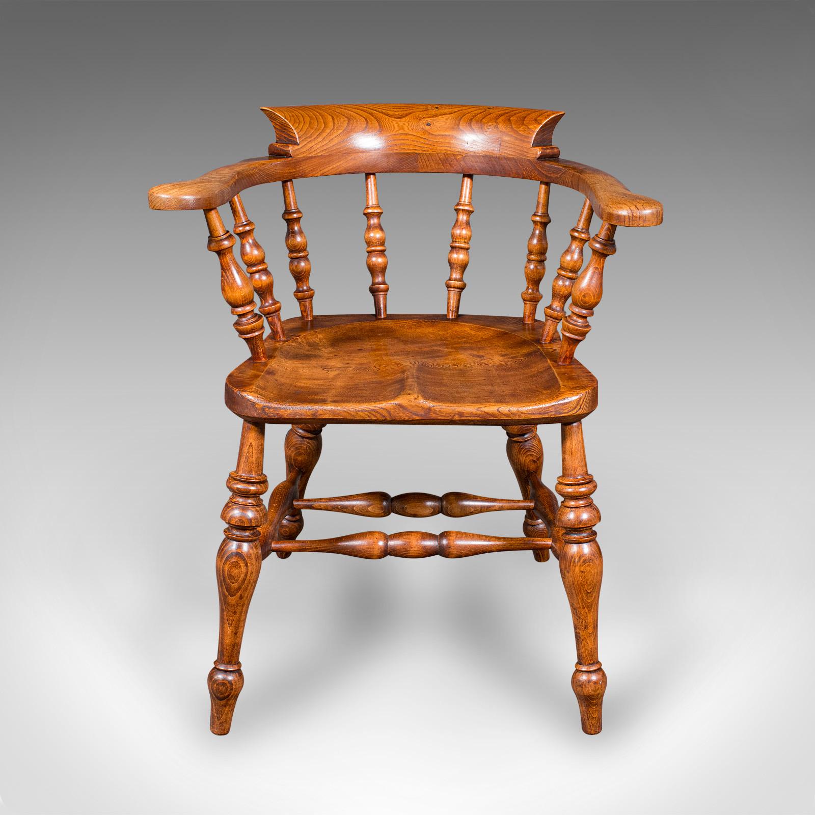 This is an antique country house captain's chair. An English, elm smoker's bow or elbow seat, dating to the late Victorian period, circa 1900.

Superb country house appeal with the classic bow form
Displaying a desirable aged patina and in good