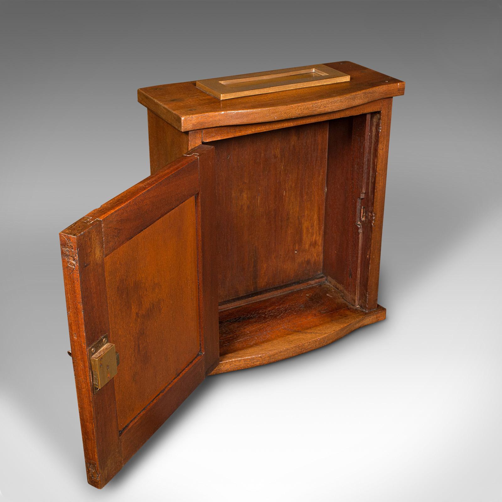 This is an antique country house hotel letterbox. An English, mahogany and brass countertop key box, dating to the Edwardian period, circa 1910.

Useful cabinetry, with a generous letterbox - ideal for a small hotel
Displays a desirable aged