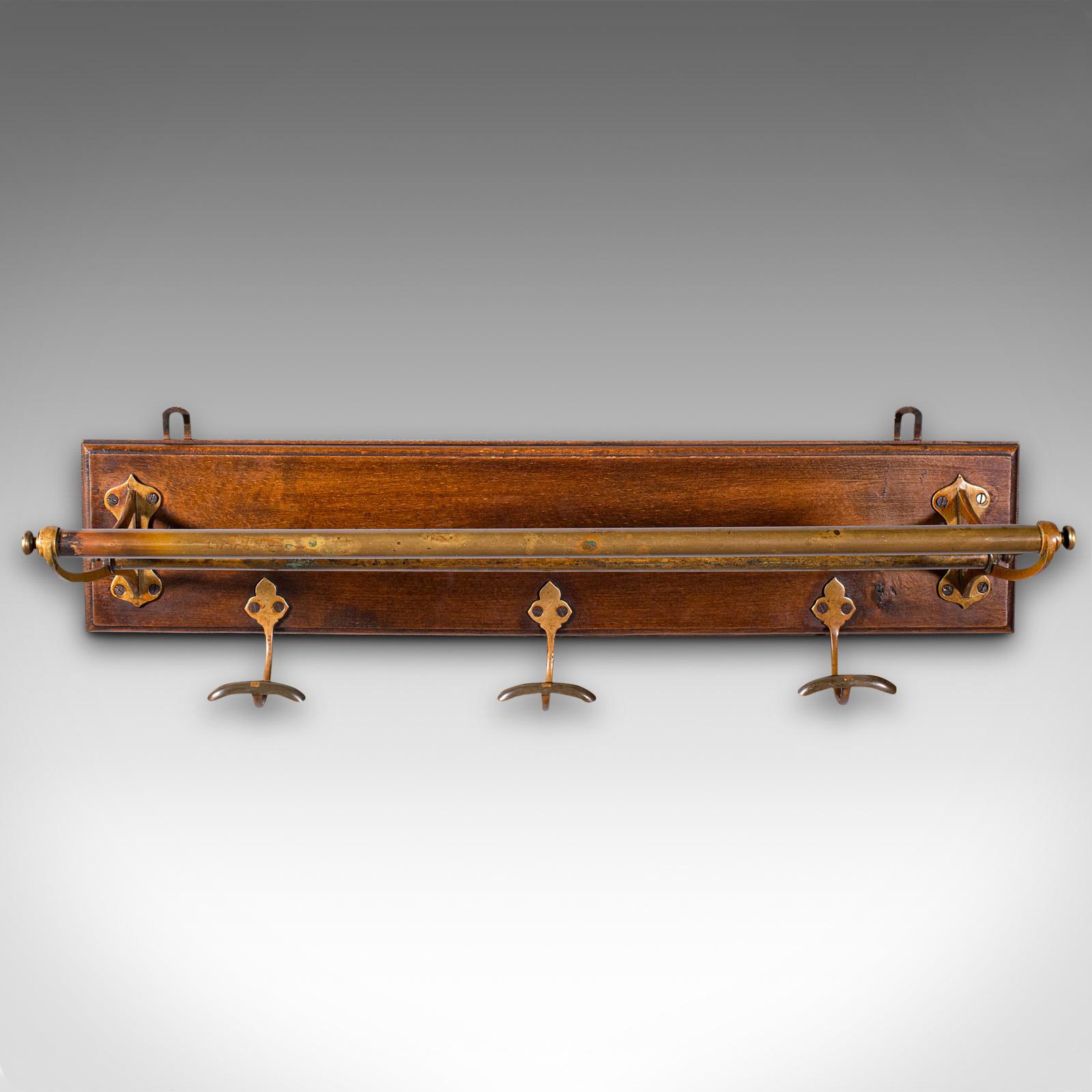 This is an antique country house wall rack. An English, brass and oak reception hall valet, dating to the Victorian period, circa 1880.

A welcome sight as you enter the hallway, with superb Victorian appeal
Displays a desirable aged patina and in