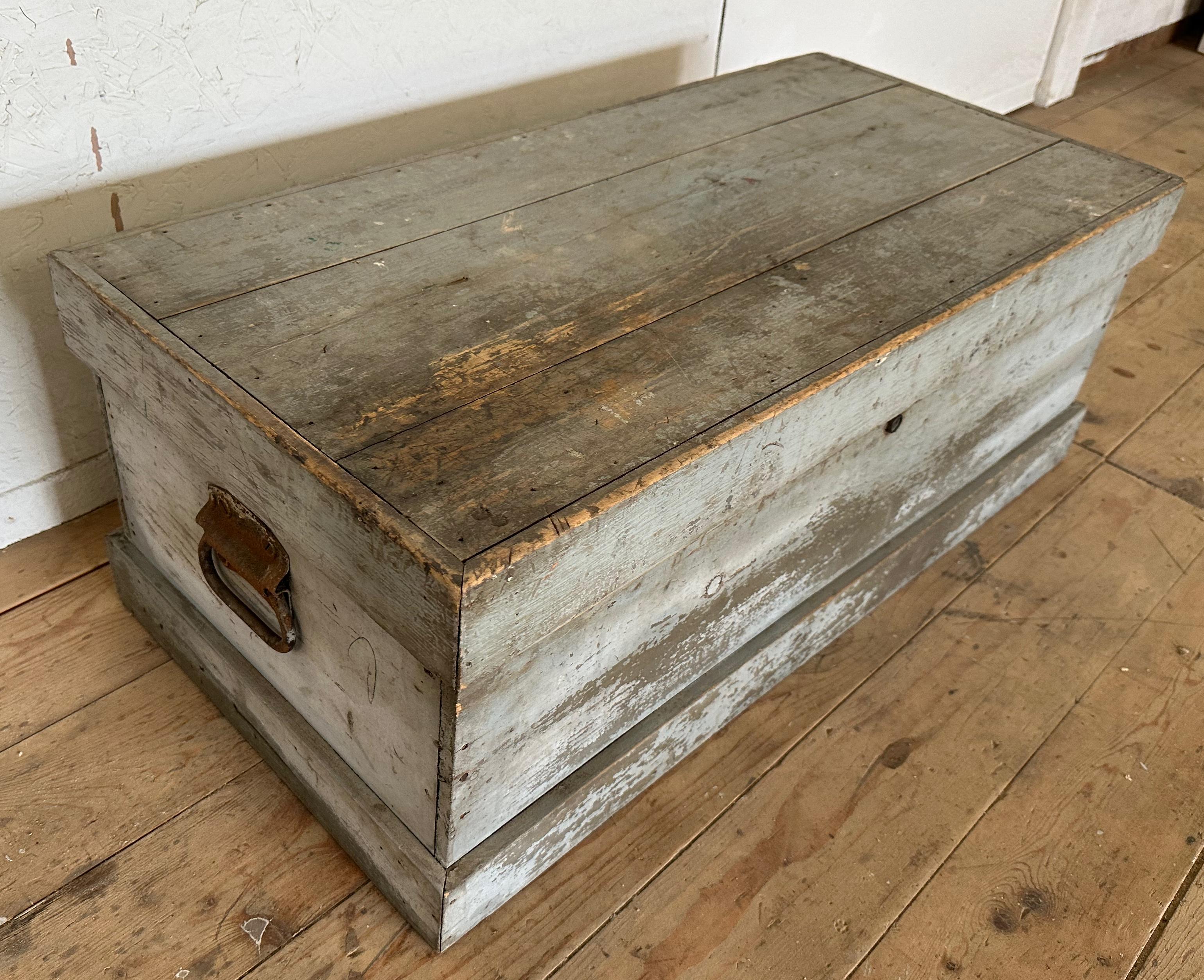 Antique American country blanket chest in beautiful original aged distressed blue painted surface. Iron handles at sides. Key for lock is no longer available. The open interior compartment is fully functional for storage.
The chest will make a