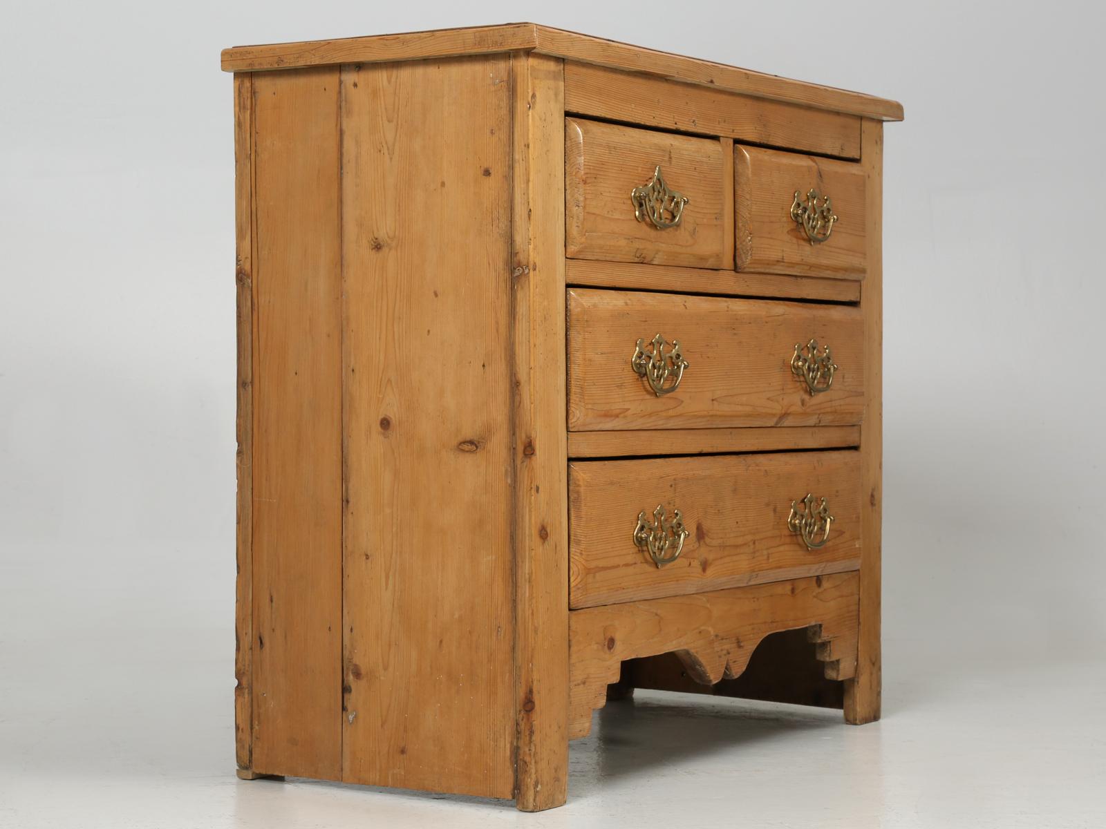 Having sold country pine here for over 25 years, you would like to think that we could tell you where this was made, but we are just not 100% sure. We do know, that this antique pine chest of drawers or dresser if you prefer, was removed for a home