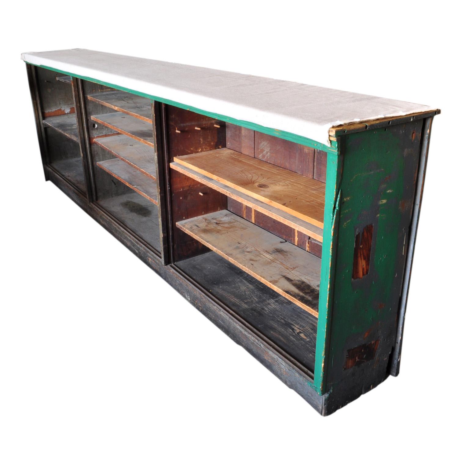 The counter's roomy shelving areas offers a generous storage and display room, designed with versatility in mind. This counter graciously accommodates an array of items, from vintage treasures and collectibles to your everyday essentials, rendering