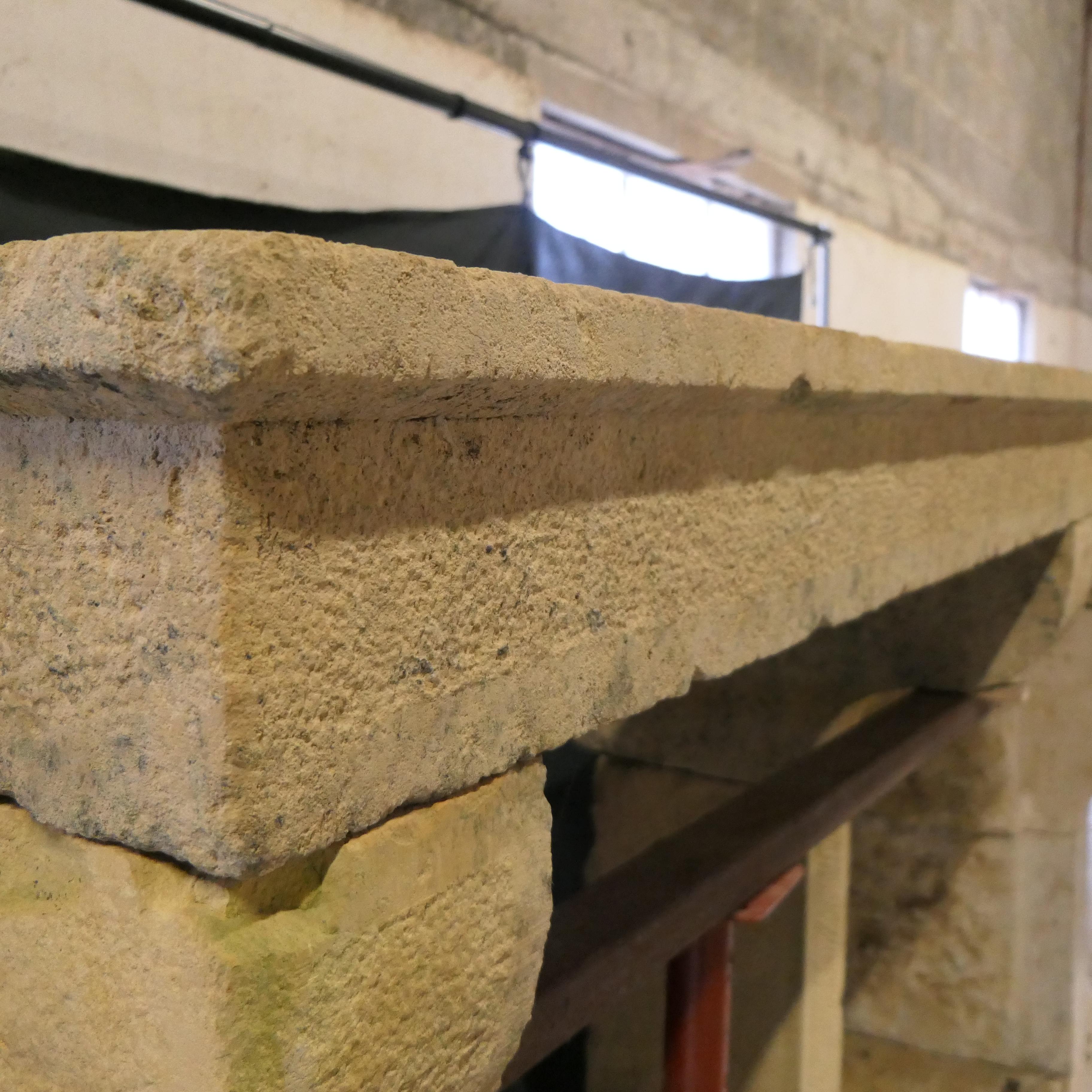 Stone Antique country-style natural stone mantel For Sale