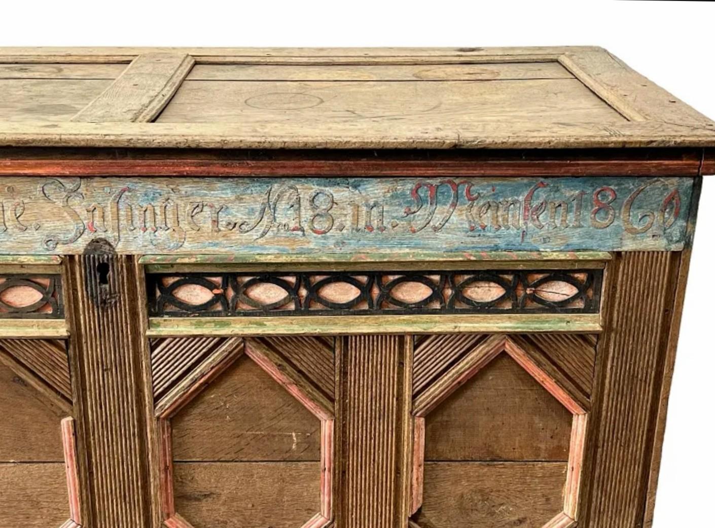 A rare, one-of-a-kind antique, circa 1860, country Swiss folk decorated wood immigrant's travel trunk.

Handmade in the Meilen region of Zürich, Switzerland, in the mid-19th century, crafted of solid oak and pine, rectangular steamer chest form with