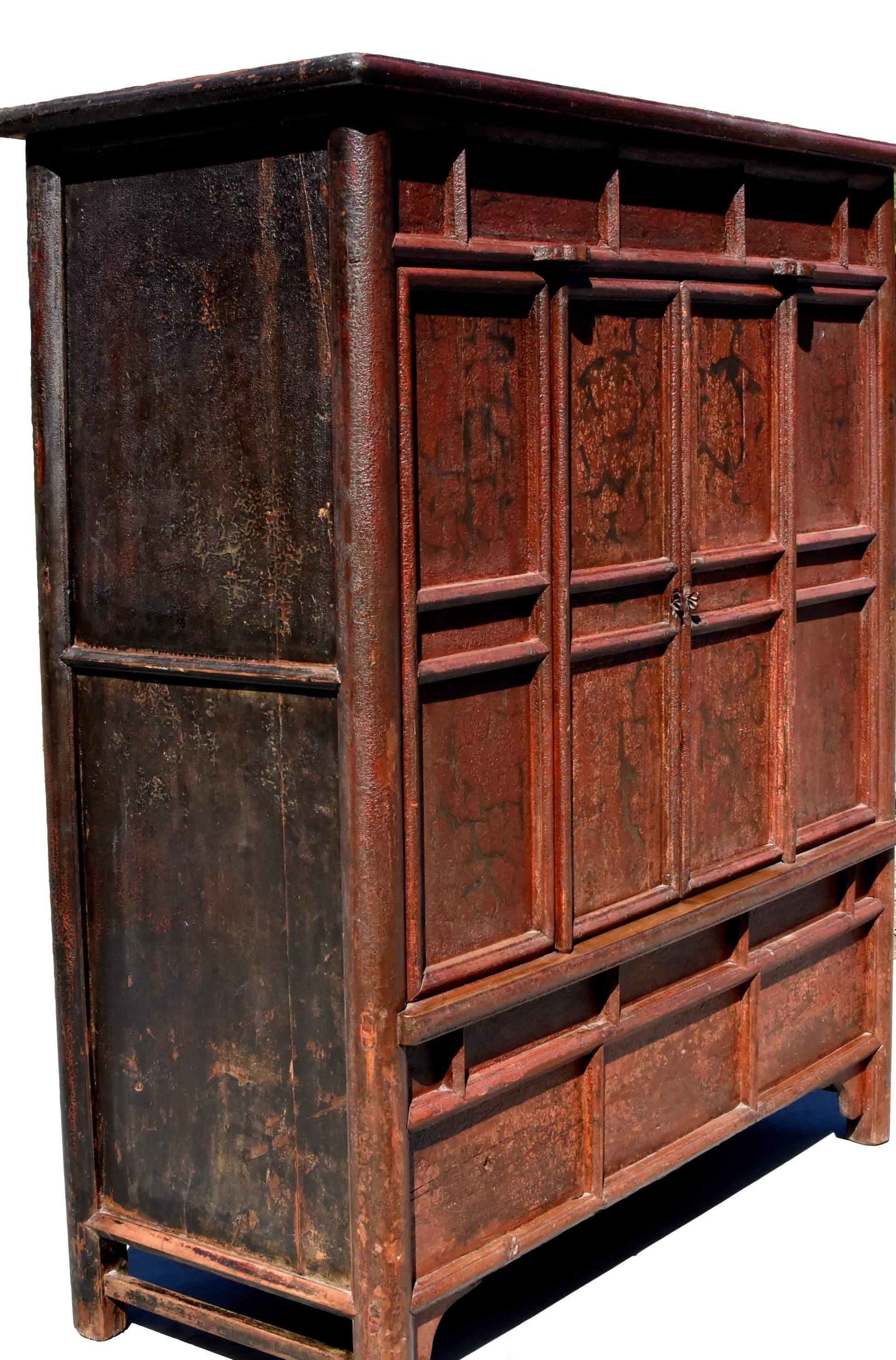 A beautiful, large, rustic, northern Chinese cabinet with crackle finish. Tenons and mortises construction. Solid wood. Removal shelf and secret compartment. Beautiful reddish brown cinnabar finish. A highly sought after piece from Shan Xi Province.