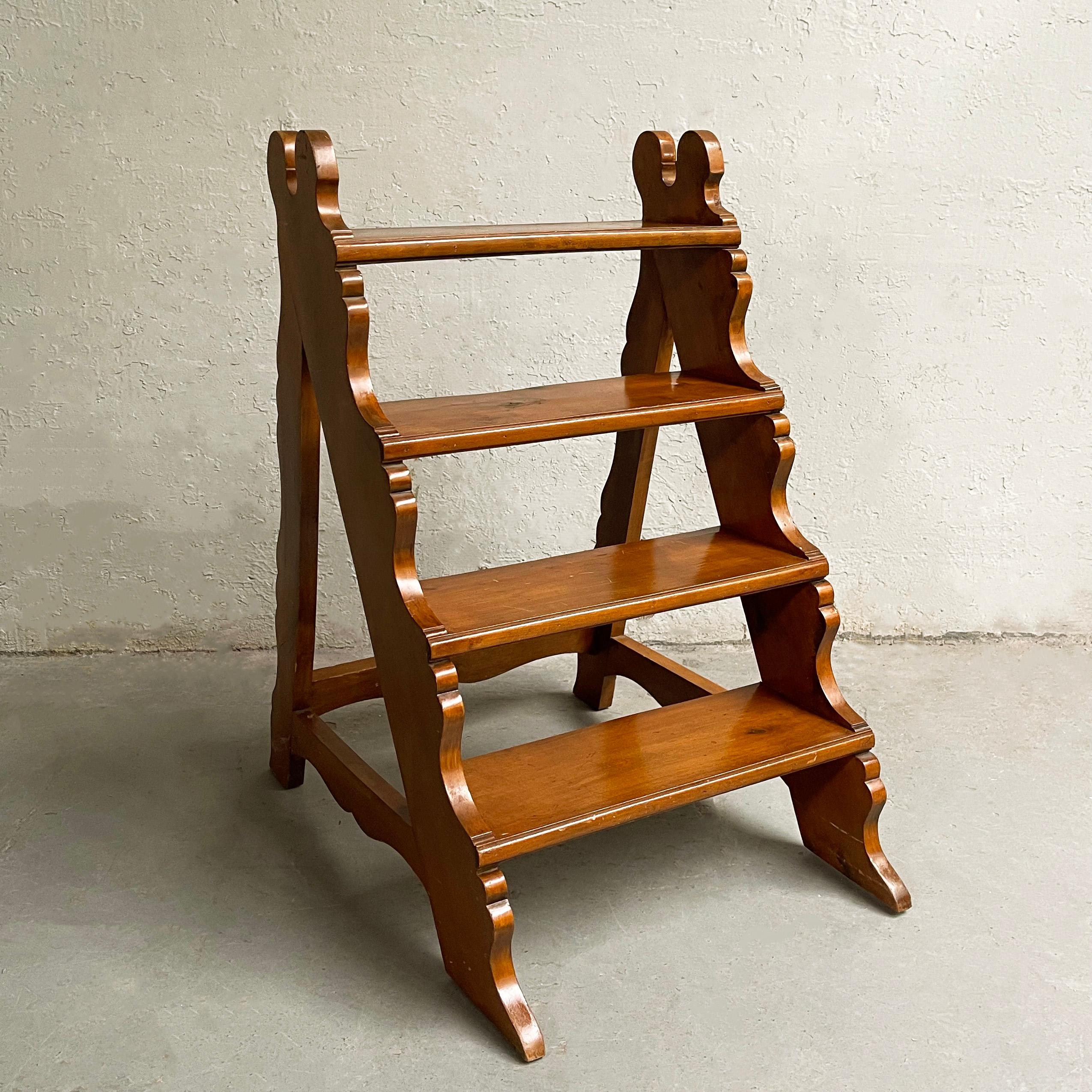 Turn of the century, craftsman, maple, A-frame, library step ladder features decoratively carved edges. A lovely piece that can be used as a ladder or accent shelf. 

