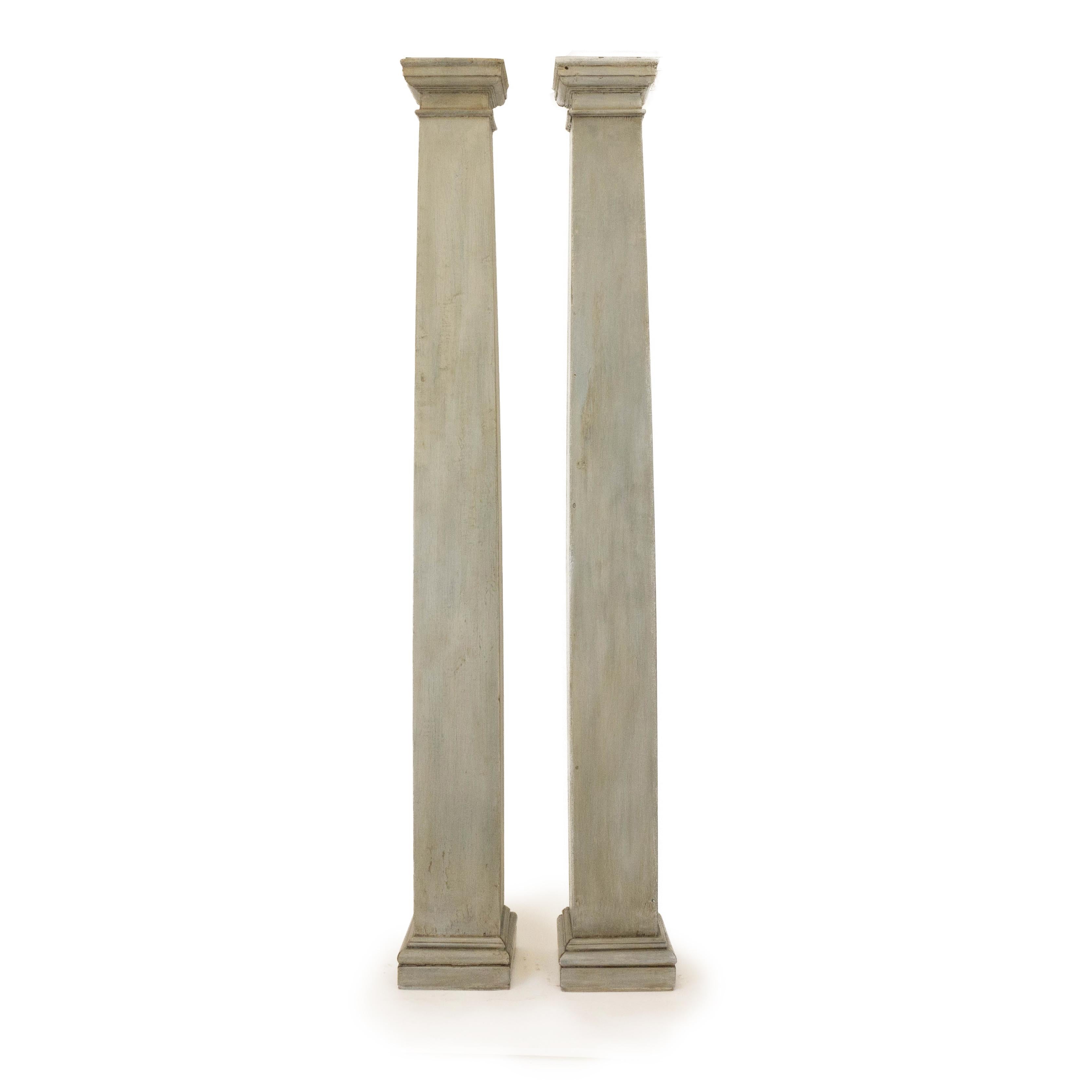 Two antique craftsman style square columns. These rustic columns are one of a kind and were discovered on an estate in Litchfield, Connecticut. Made out of solid wood, these columns stand sturdy. The finish is a combination of warm and cool tones