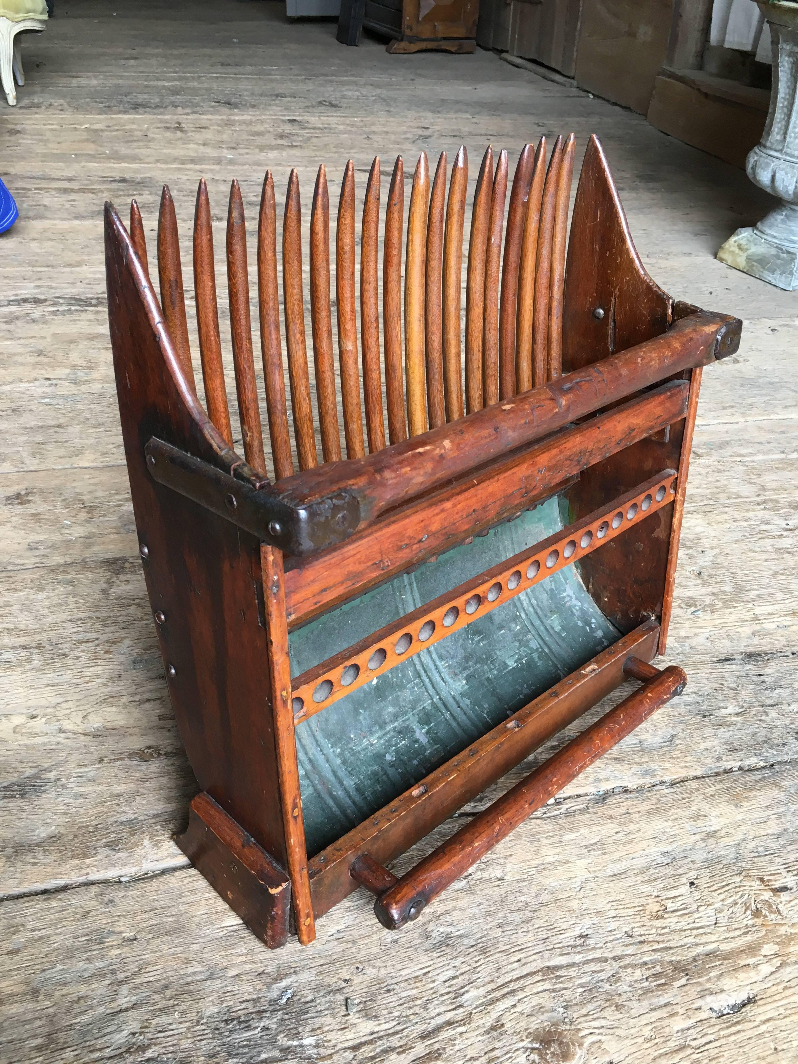 A handmade cranberry harvest scoop, circa 1900
Can be used as a cool magazine or spice rack.