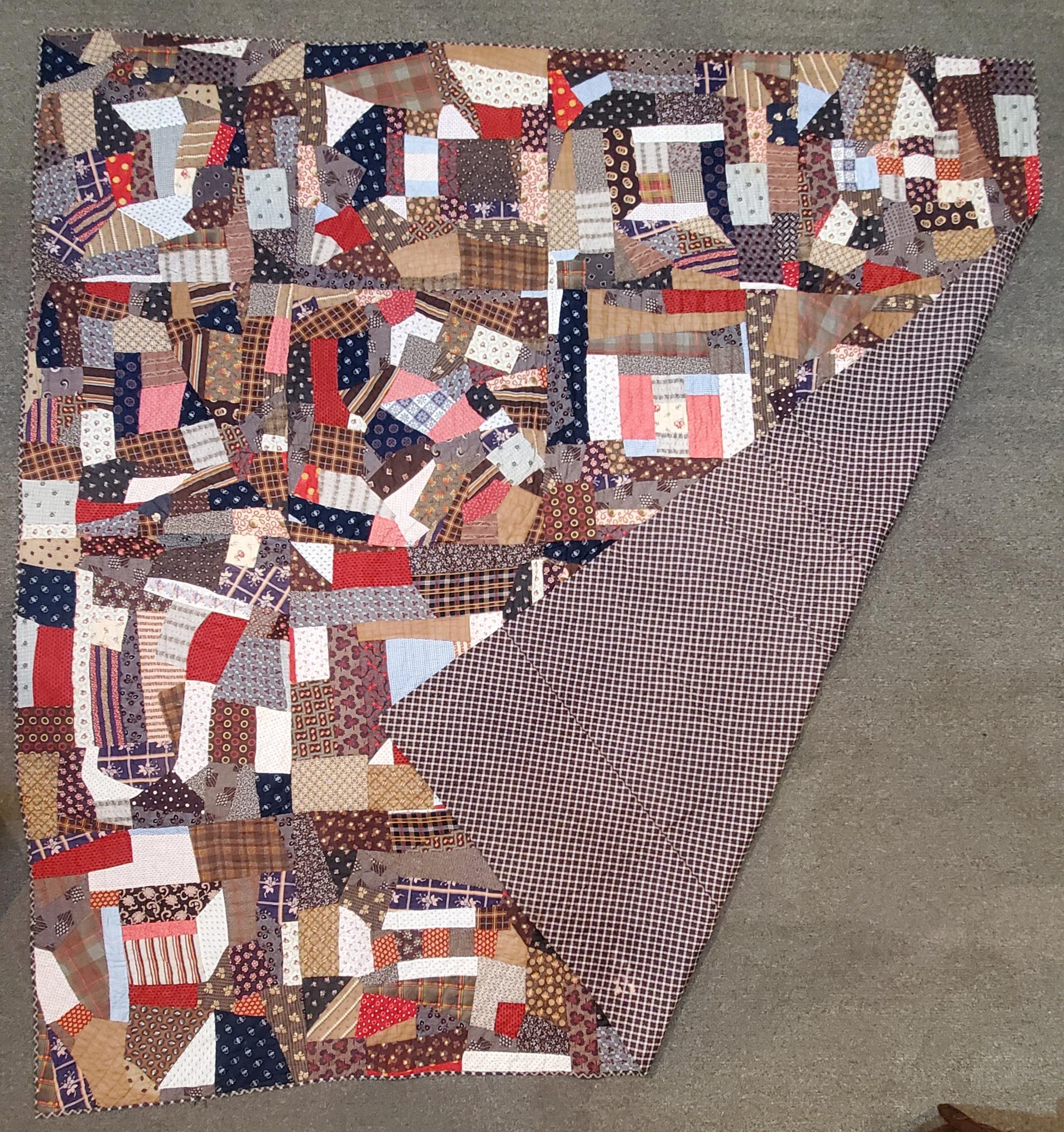 This 19thc cotton crazy quilt is in amazing unused condition. It was found in Lancaster County, Pennsylvania and has a amazing striped ticking backing.