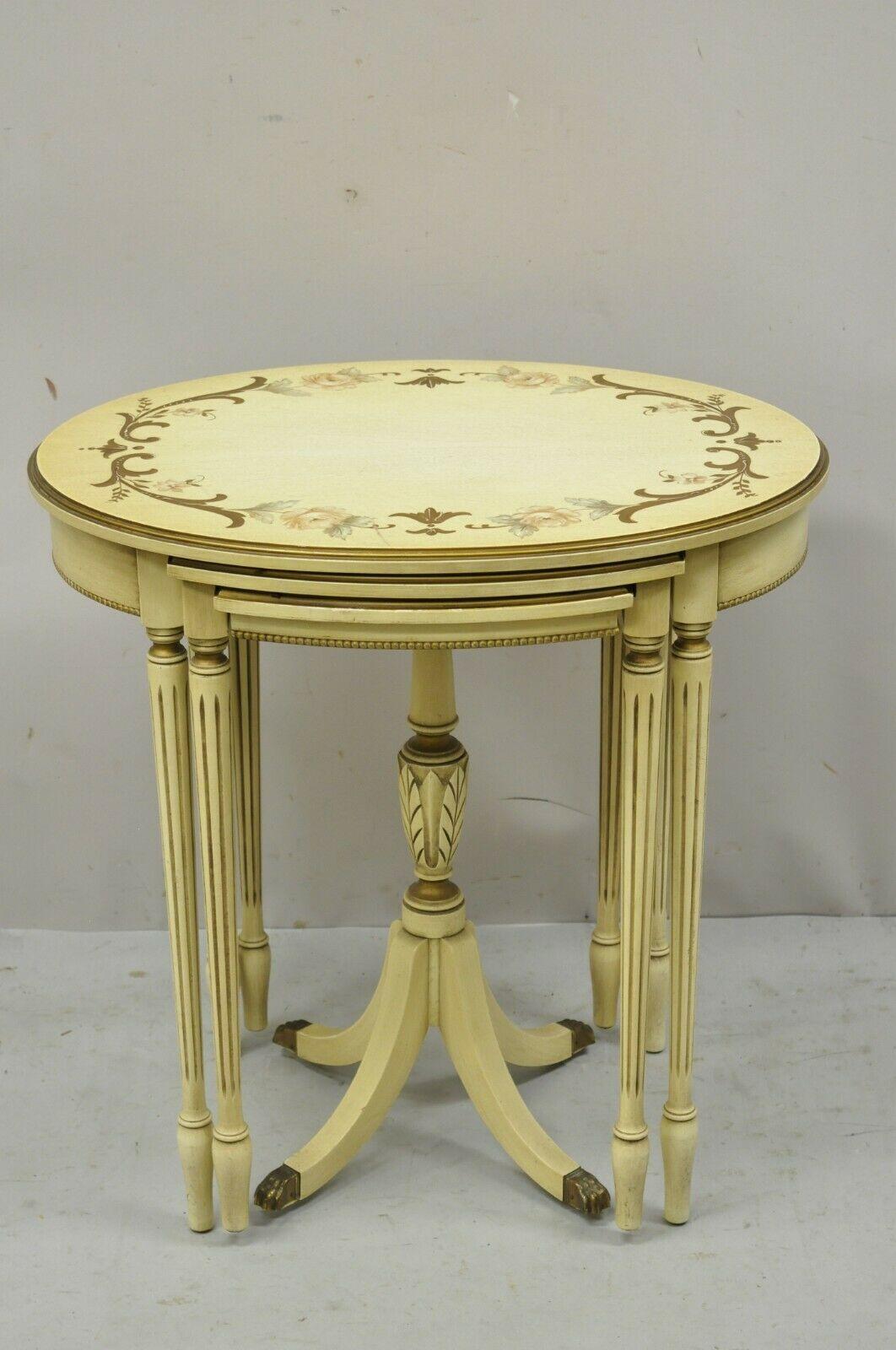 Antique Cream Painted French Style nesting side tables by Imperial Grand Rapids - Set of 3. item features 3 graduating sized nesting tables, larger table with oval top, smaller table with Duncan Phyfe pedestal base, hand painted floral details,