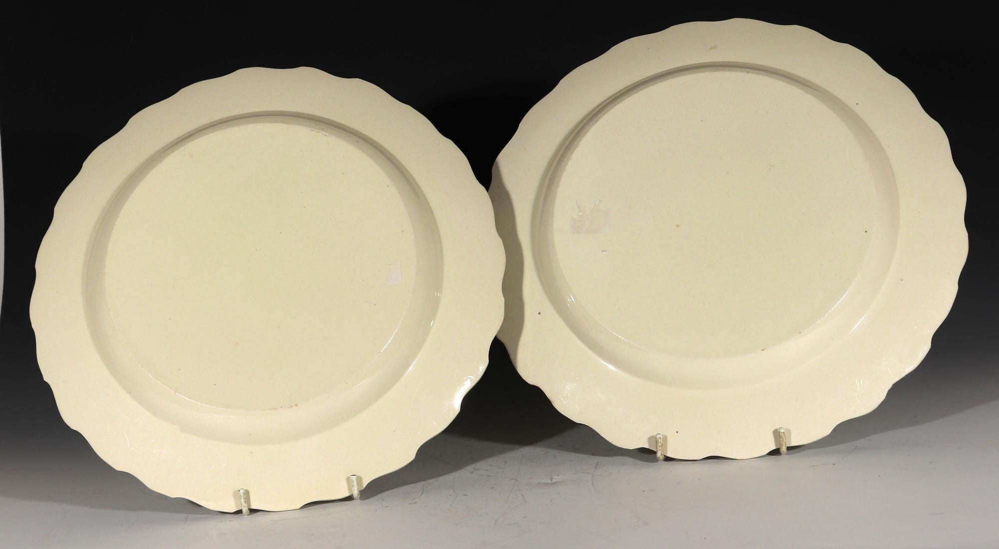 From a collection of creamware dishes-
Antique Creamware Feather-edged Circular Dishes,
Pair,
Probably Leeds,
1780-1800

The deep plain creamware circular dishes have a moulded feather edge rim with a wonderful cream color. These dishes could