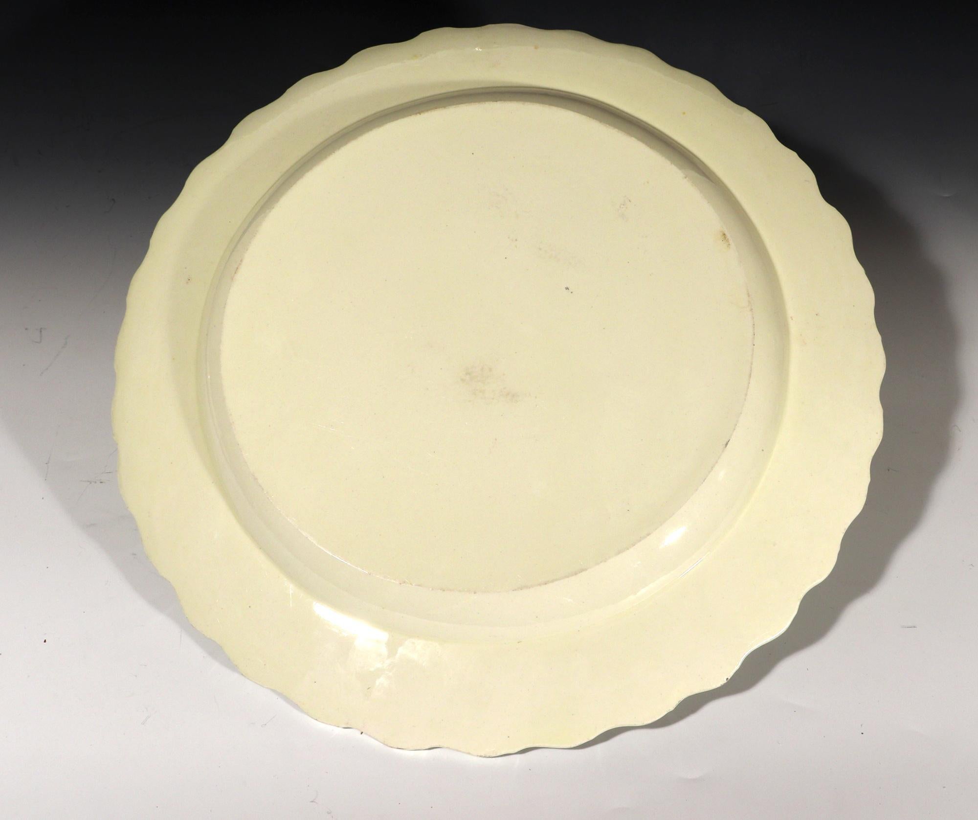 From a collection of creamware-
Antique 18th Century Creamware Large Feather-edged Circular Dish,
Possibly Leeds,
1780-1800

The deep plain circular creamware circular dish has a moulded feather edge rim.

Dimensions: 11 inches x 1 inches