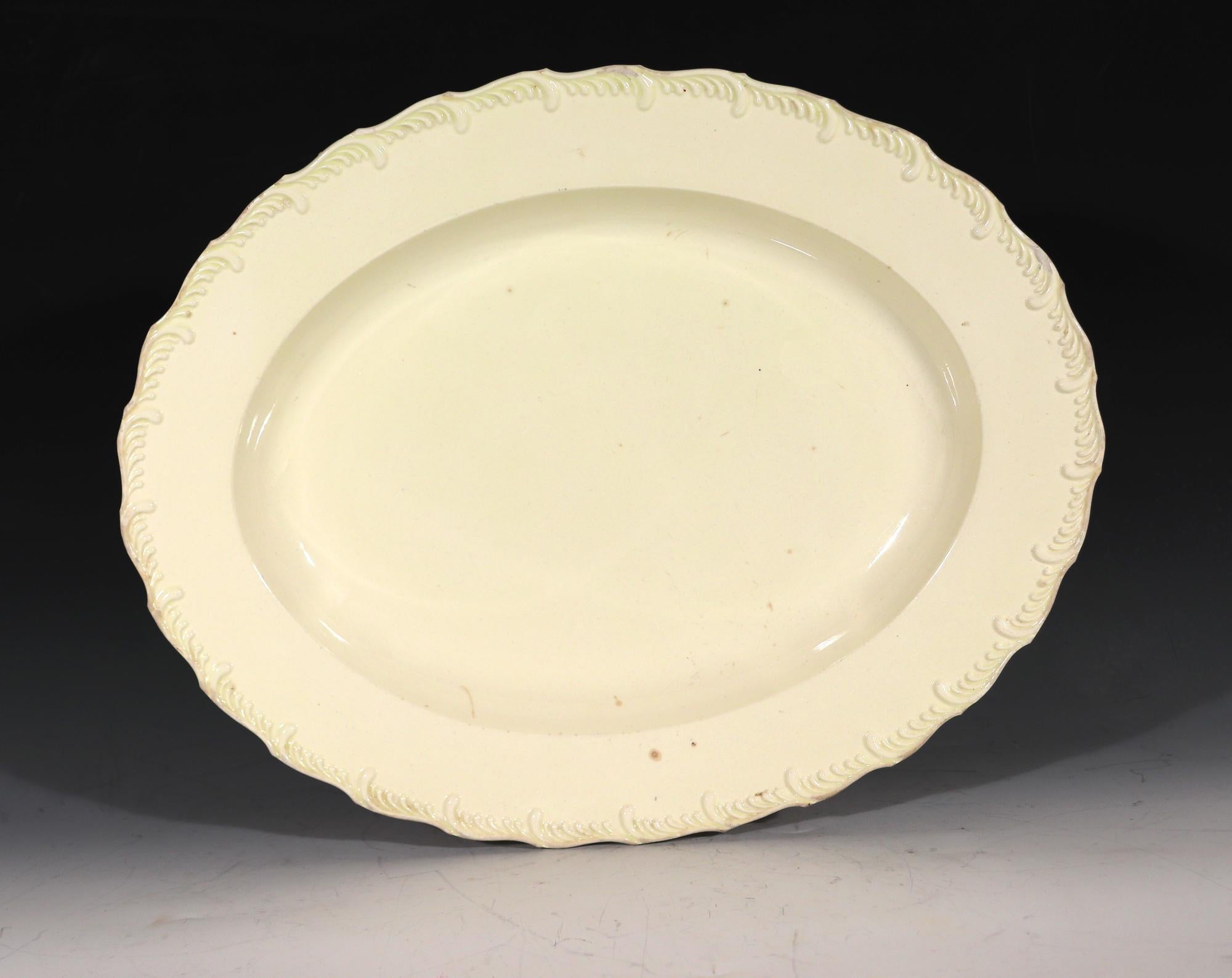 From a collection of creamware-
Antique Creamware Large Feather-edged Oval Dish,
1780-1800

The deep plain creamware oval dish has a moulded feather edge rim.

Dimensions: 14 inches x 11 inches x 1 3/4 inches high

In 1765, Wedgewood