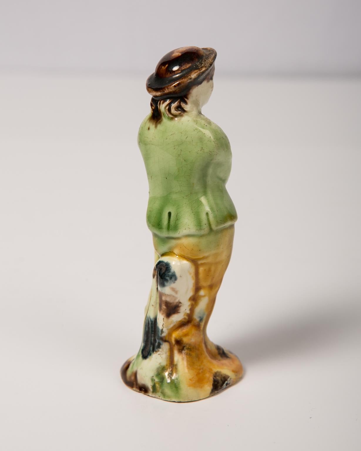 WHY WE LOVE IT: Sometimes, the smallest thing gives you the most pleasure.
We are pleased to offer this creamware figure of a young man. Made in 18th century England at some point, he became part of the collection of Colonial Williamsburg and was