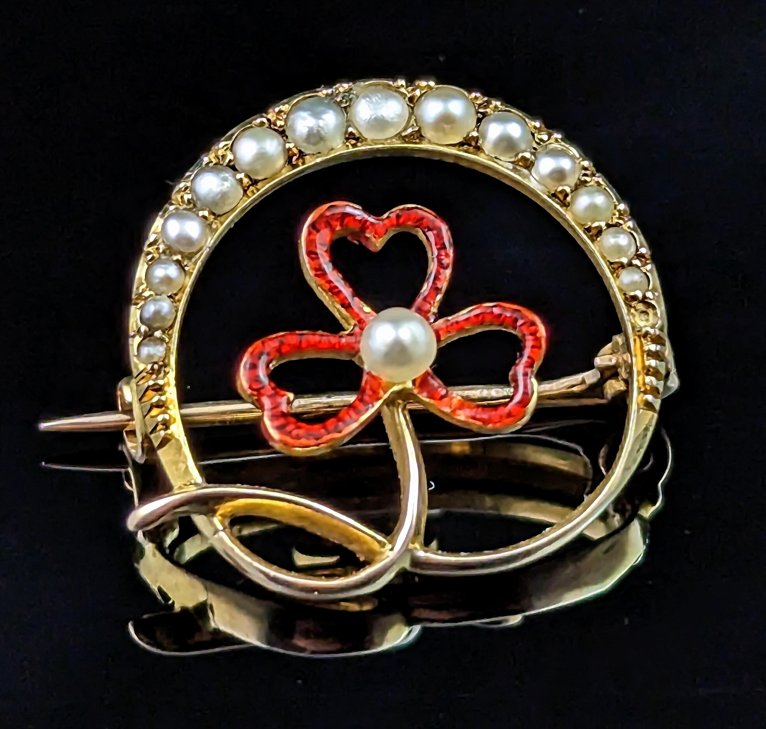 This Sweet antique crescent and shamrock brooch is so amazingly beautiful.

A scarce and unusual piece it is a delicate and dainty piece with a beautiful yet bold design.

The brooch is crafted in rich 15kt yellow gold with a pretty pearl set