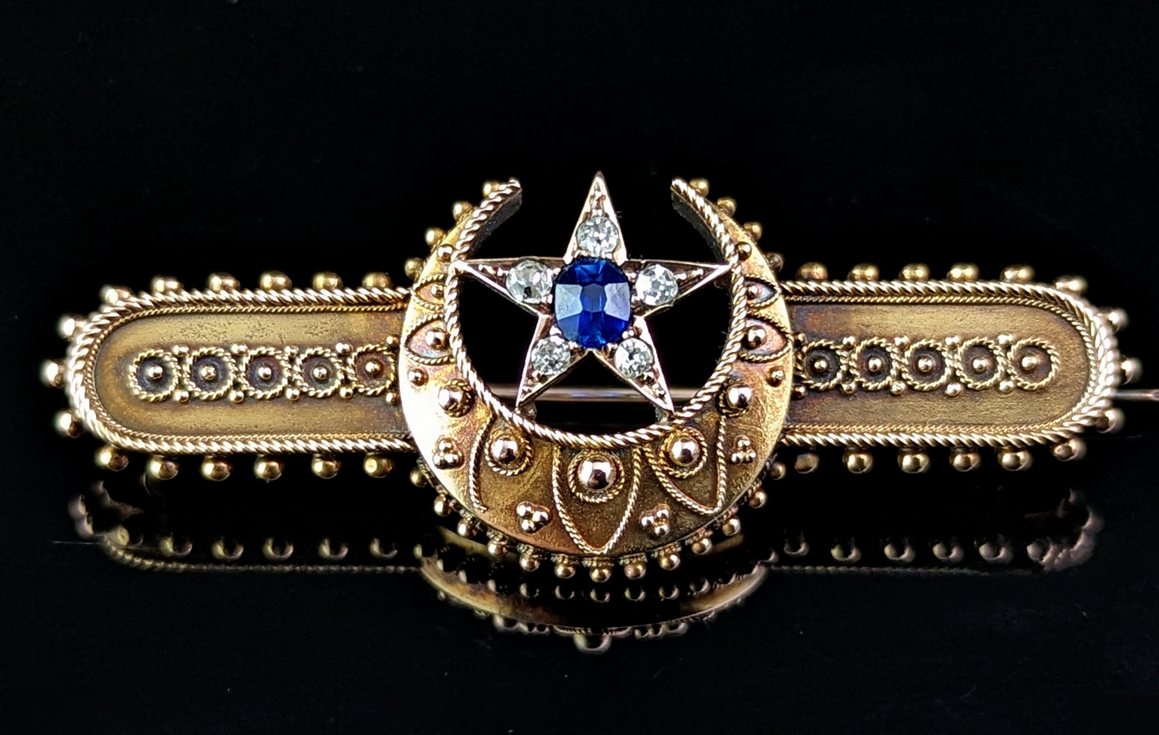 This magnificent antique Victorian era crescent moon and Star brooch is really something special.

Finely crafted in the Etruscan revival manner in rich 15ct gold with cannetille detailing and beading around the border.

It features a crescent moon