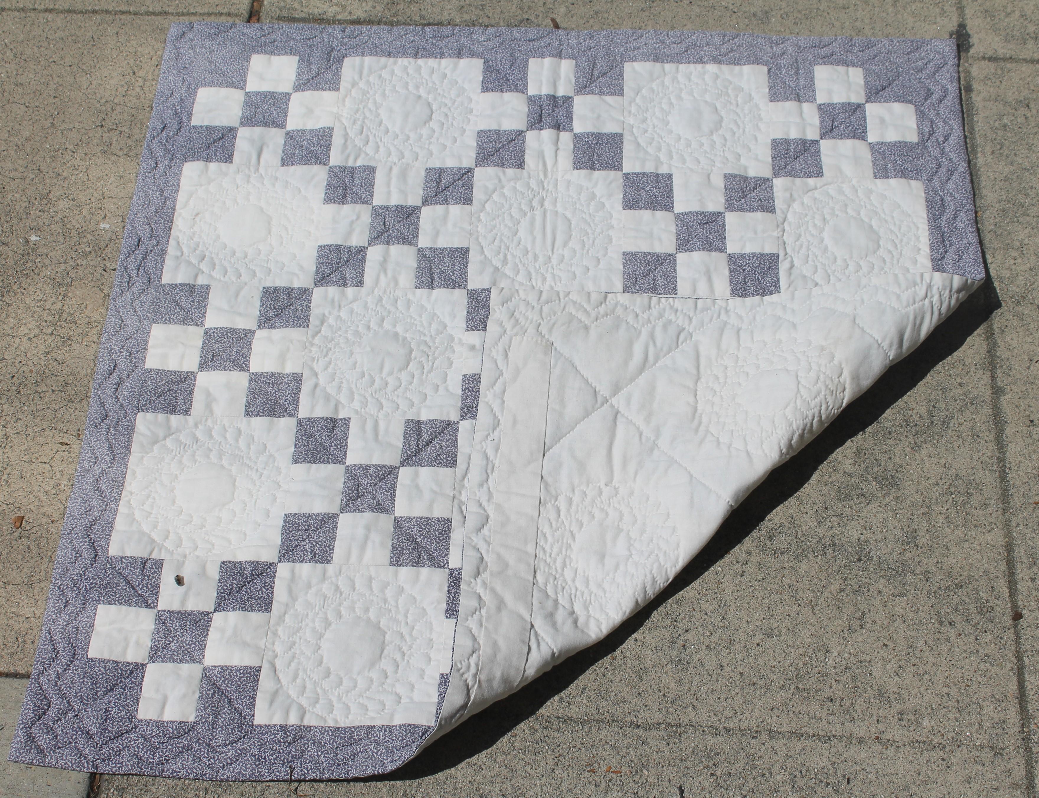 Antique five patch crib quilt in fine condition. The color is mulberry calico print with very fine tight quilting.