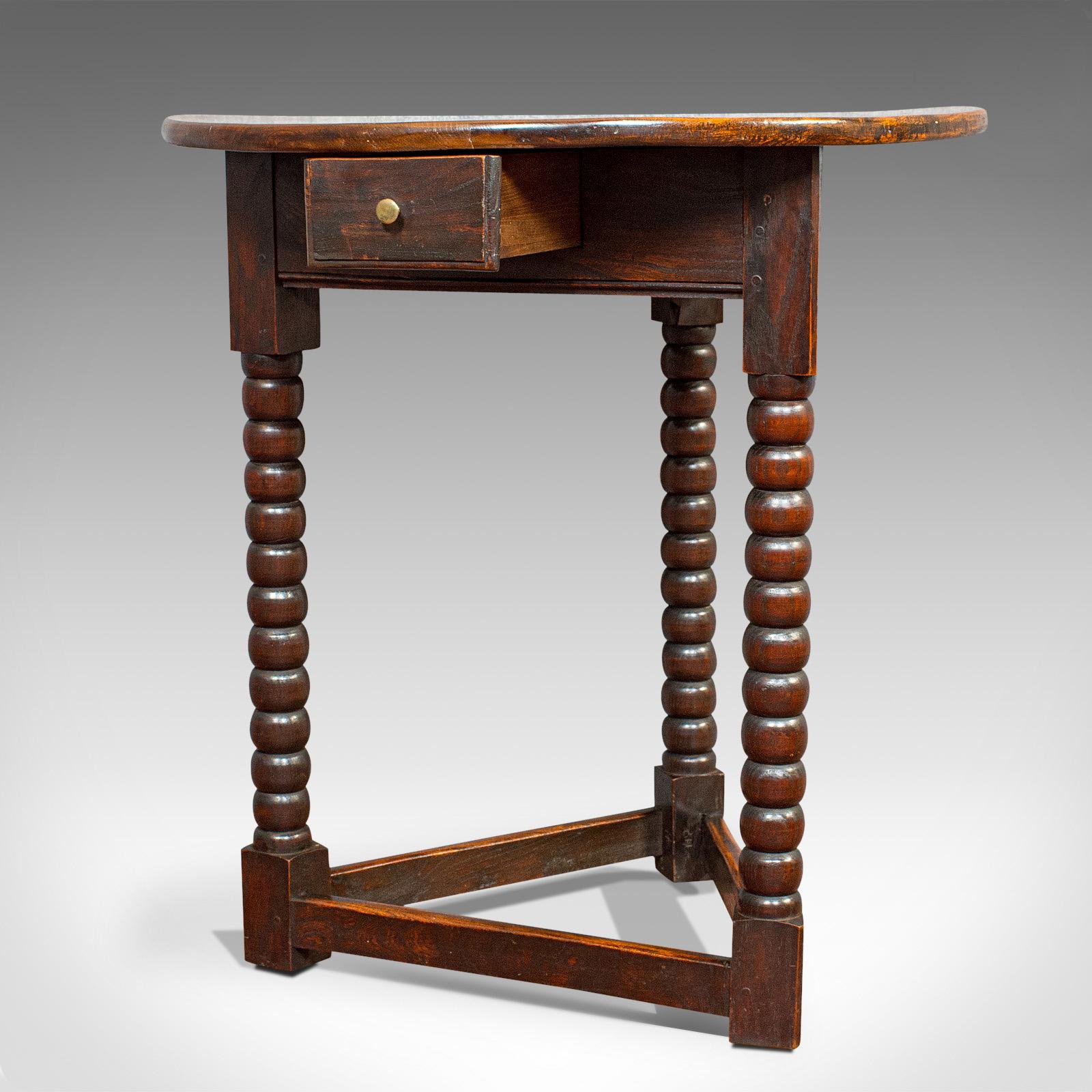 This is an antique cricket table. An English, elm lamp or side table with drawer, dating to the Victorian period, circa 1890.

Fascinating table with appealing form
Displays a desirable aged patina
Select elm with rich, consistent hues and fine