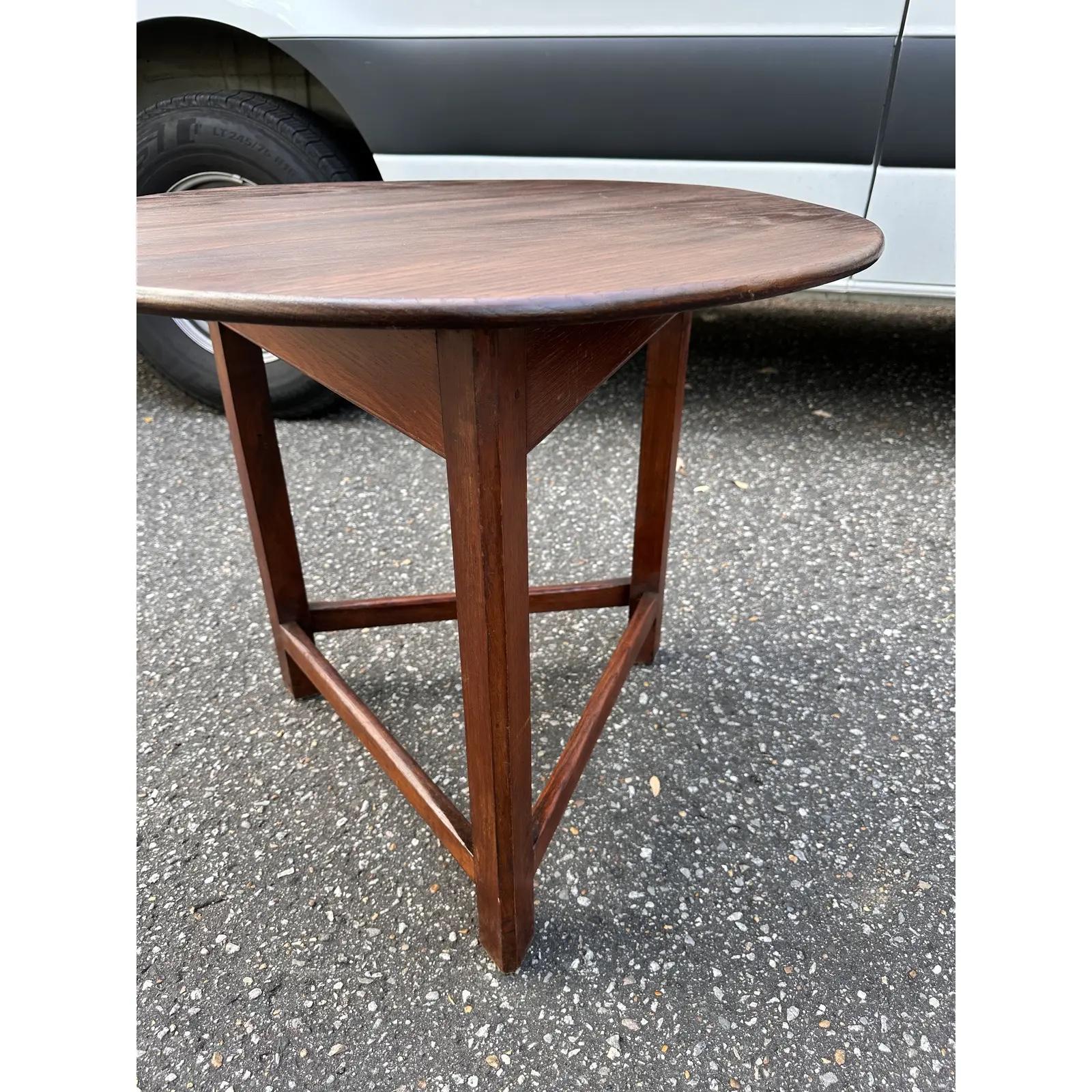 This is an adorable little English cricket table! It has such amazing patina the height makes it a perfect piece beside a chair are sofa. The rich deep wood tones of the table blend together beautifully and is intensified by this piece's lovely