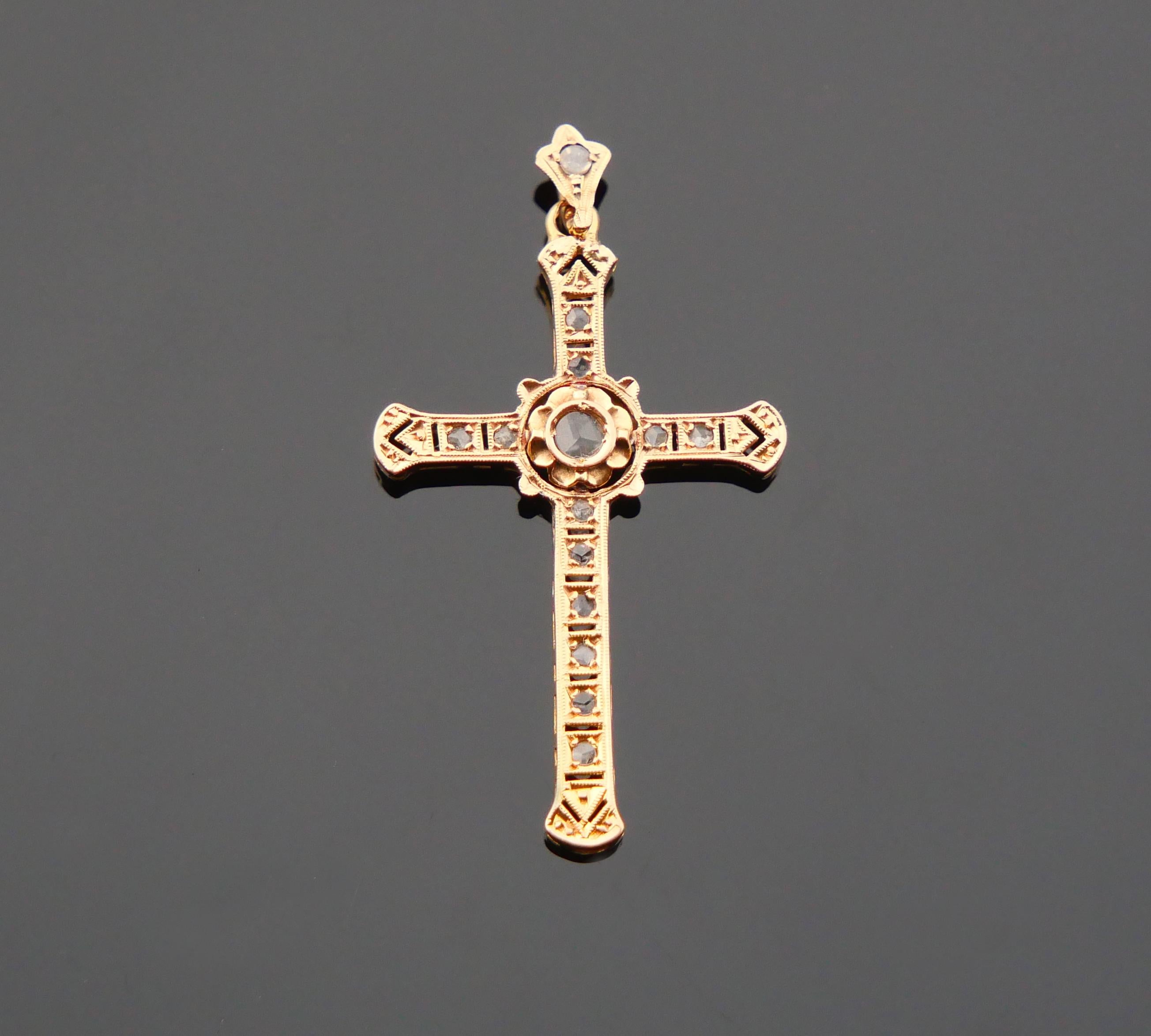 Antique ca. early XX cent. European openwork crucifix pendant skillfully set with 14 rose cut Diamonds / 3 facets on each stone.

Central Diamond Ø 3mm/ ca.0.14 ct + 12 Ø 1.25 mm / ca. 0.01ct each + one on the bail Ø 1.5 mm /ca.0.015ct.
Total weight