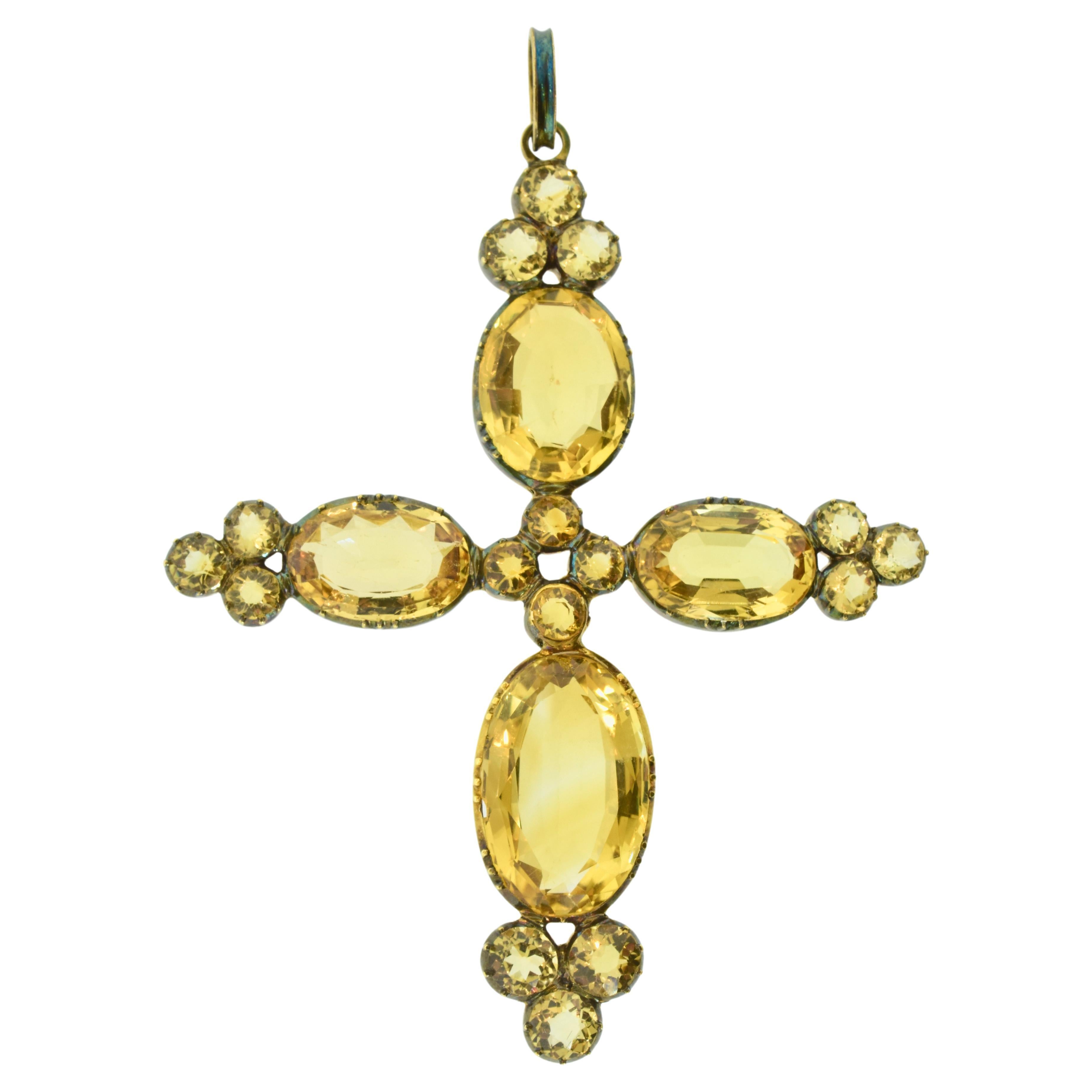 Antique cross early 19th Century cross of approximately 30 cts. natural lemon yellow Citrines. The larger oval cut stones have fancy pavilion facets which reflect the light well.  The 20 stones are both old mine cut in an oval shape, they are set
