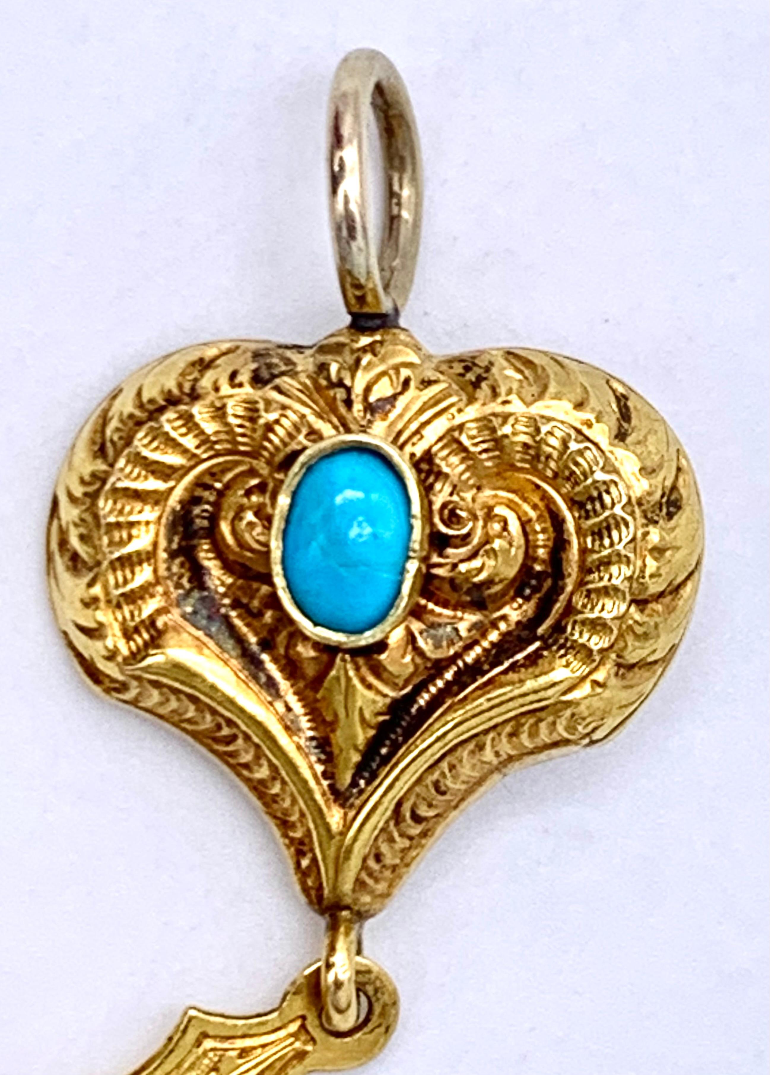 gold cross with heart pendant