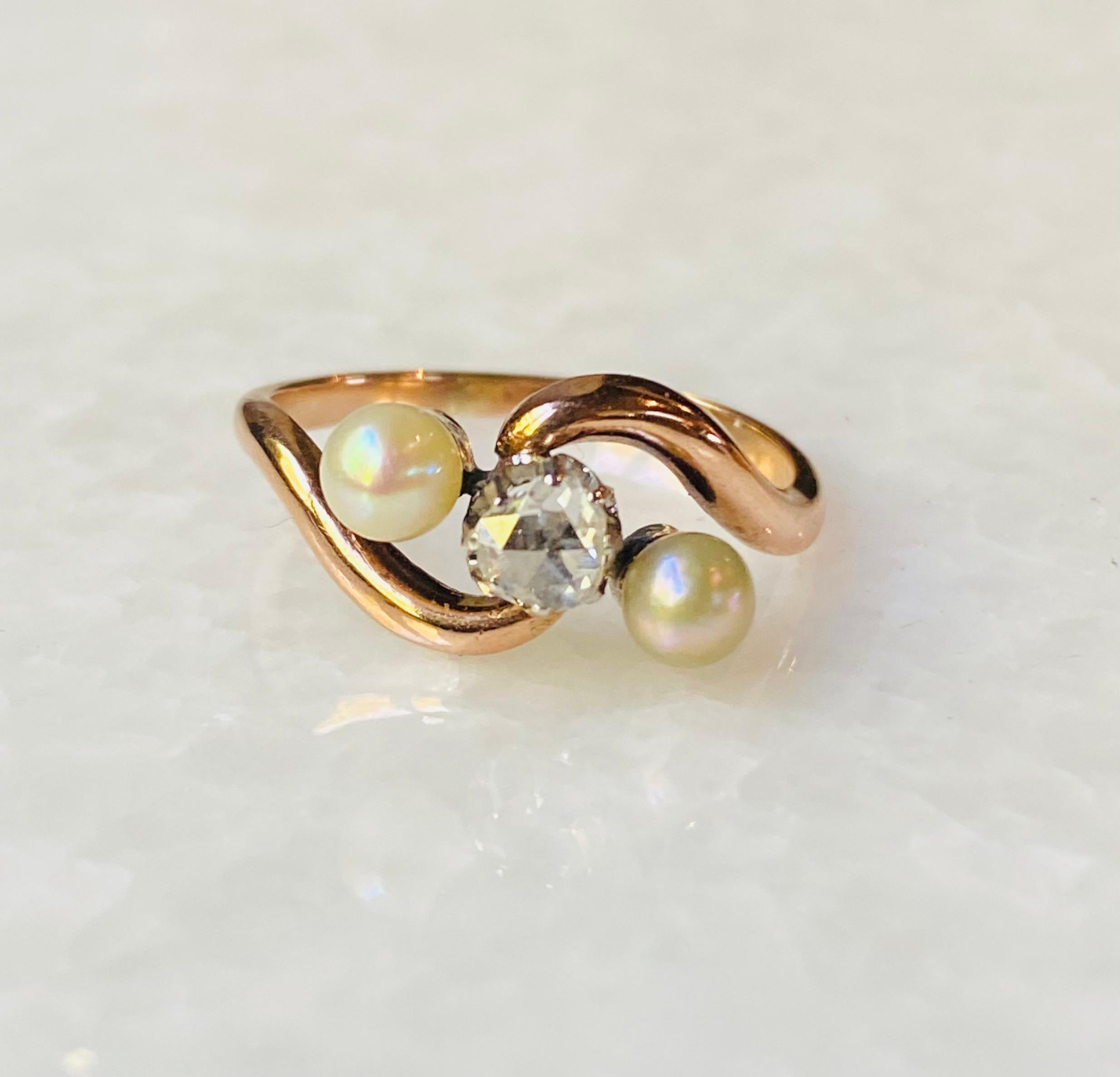 Antique Cross over Ring with High Quality Natural Diamond and Two Pearls.

Gorgeous and timeless antique crossover ring with high quality natural diamond and two pearls. This antique ring from the 1900S, is set with one high quality rose cut