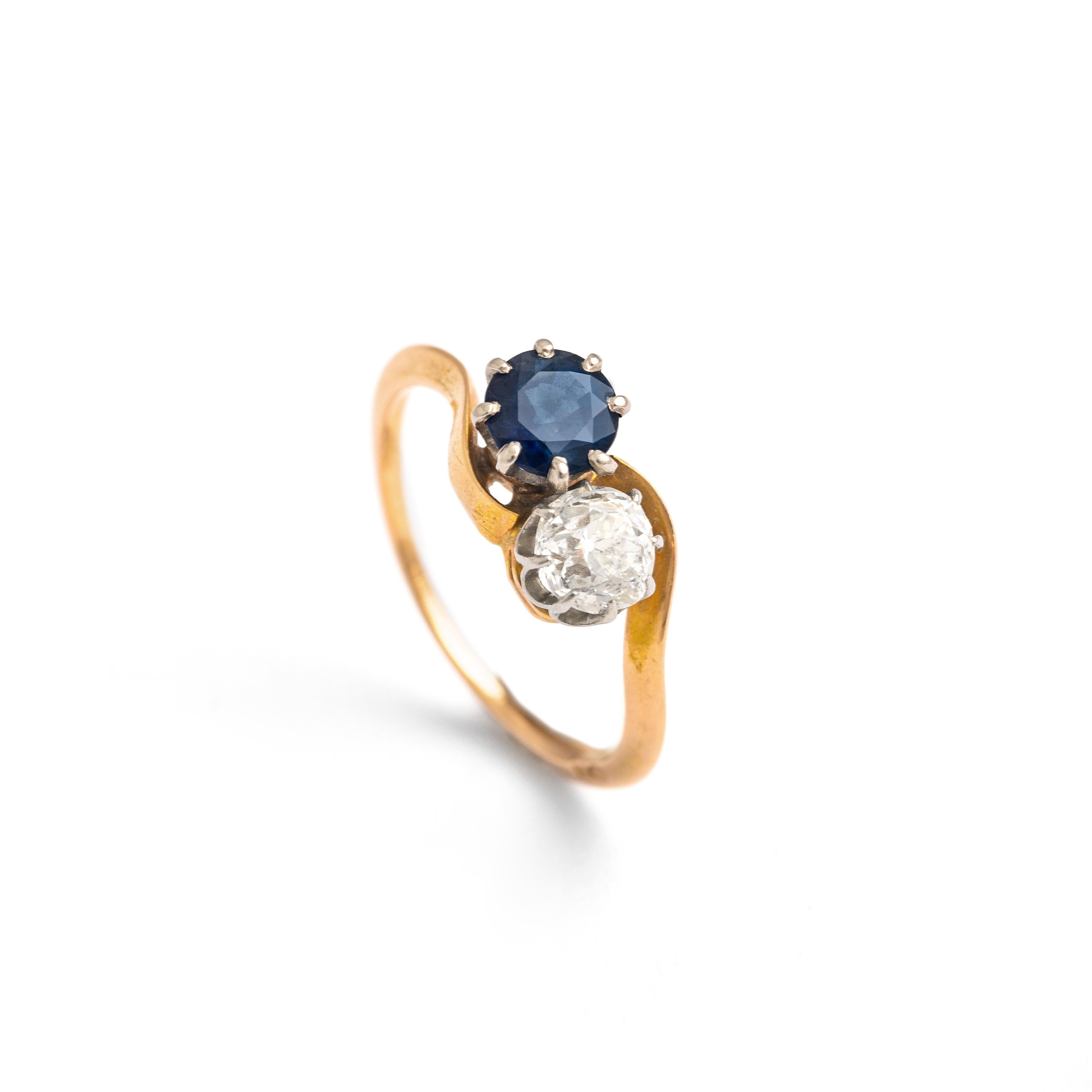Crossover Old mine cut Diamond and round cut Sapphire approximately 0.50 carat each on platinum and 18K gold ring.
Size: 51.5 / 5.75 US.
French assay marks.
Early 20th Century.