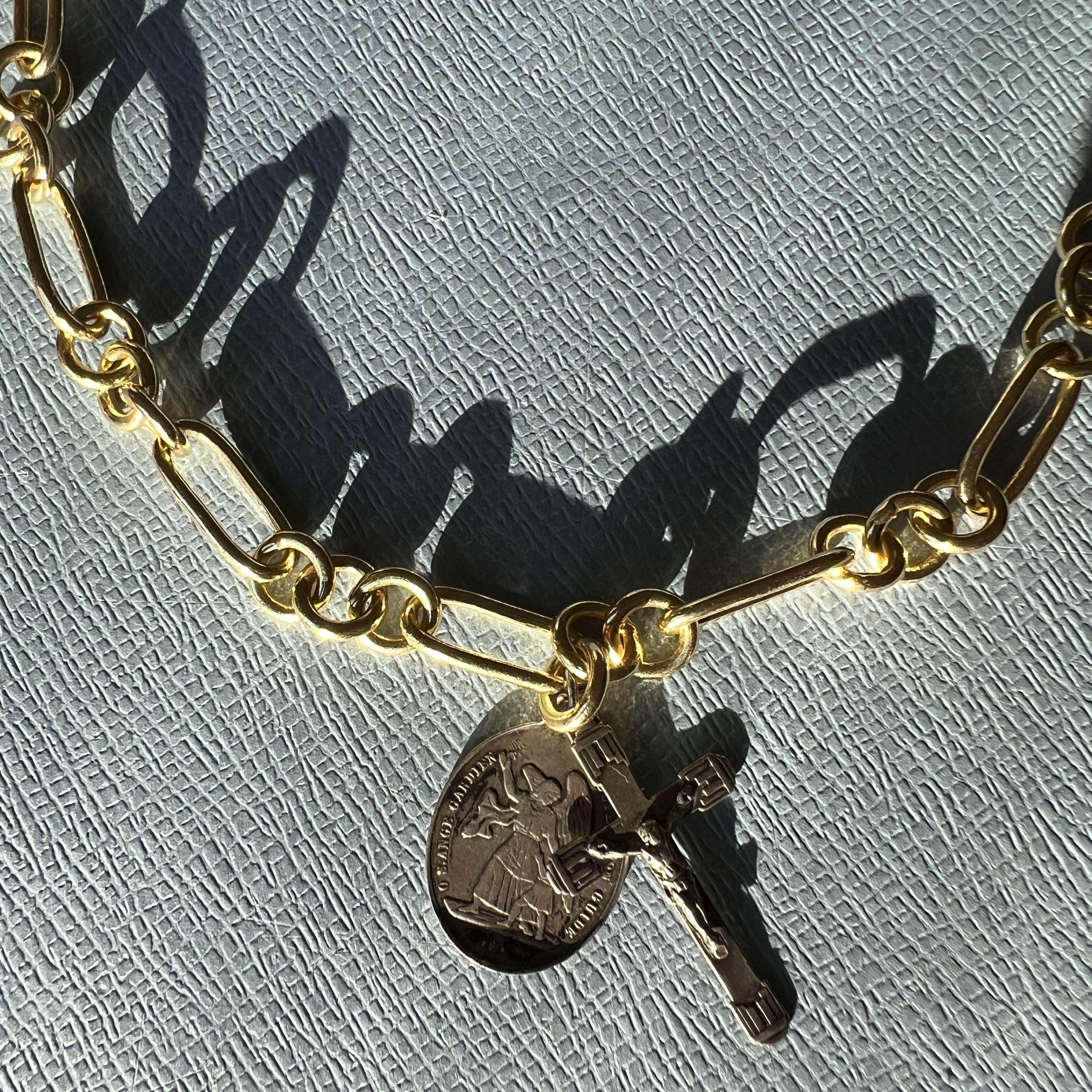Antique Crucifix Medal Necklace Guardian Angel Silver Vintage French hanging on a Gold Plated Chain Choker,
Chain can be changed to a thin silver chain if requested

Vintage or Antique French Crucifix Cross and Angel Medal in Solid Silver hanging on