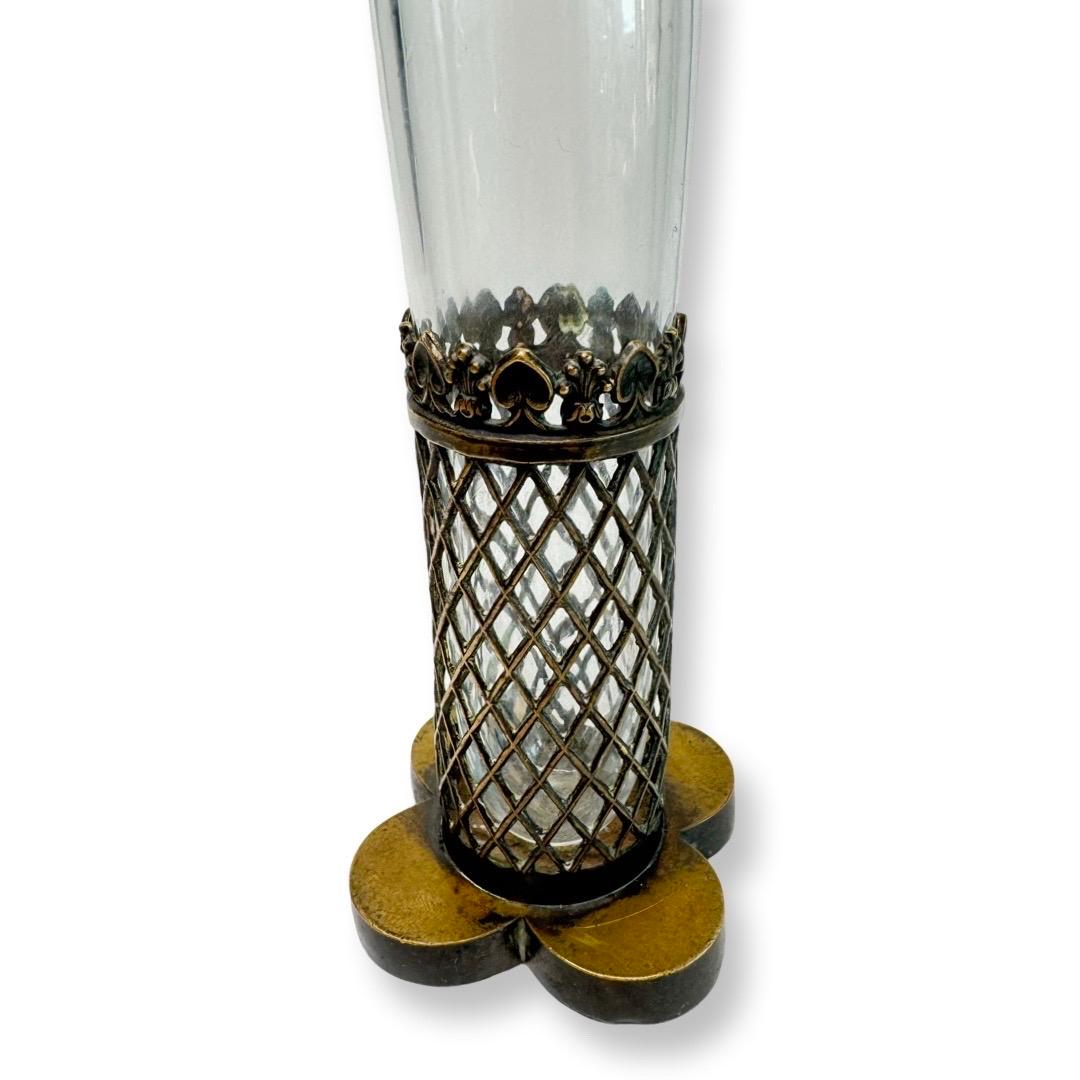 A rare and exquisite flask from the 19th century, crafted in France during the Charles X era. This unique piece combines a crystal body with a bronze mount featuring an intricate lattice pattern and Gothic arches. The original bronze base is adorned