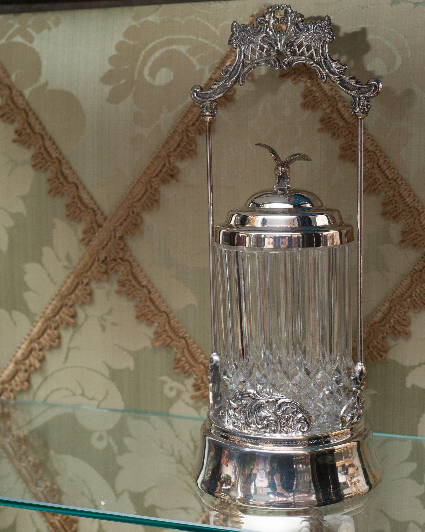 In recent years pickling has enjoyed a revival. Placed in a contemporary kitchen, filled with pickled vegetables in vibrant colors, this antique silver plate and crystal pickle jar with eagle finial adds value and becomes alive.