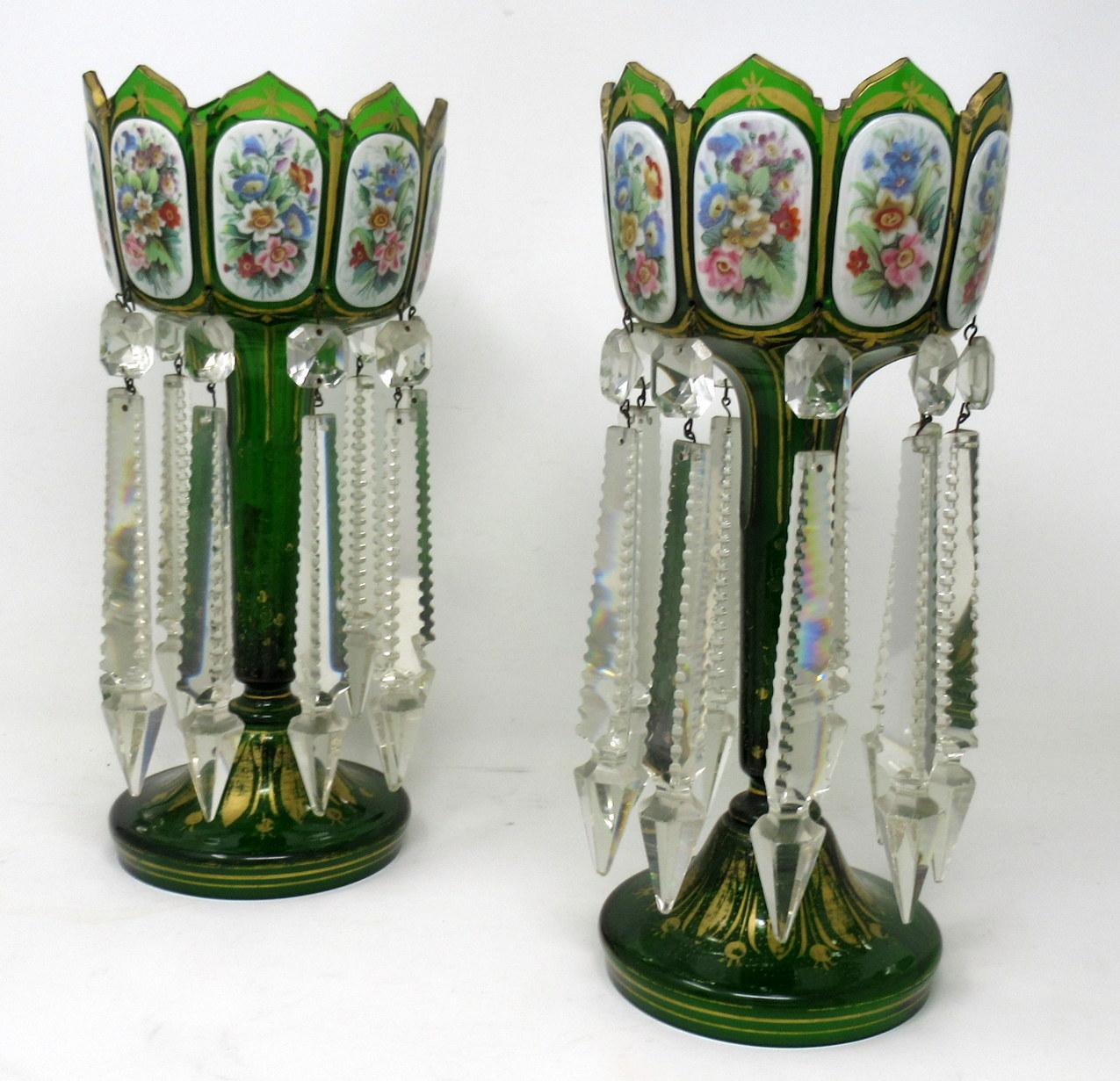 A stylish example of a fine pair of bohemian emerald green ground gilt heightened white enamel hand cut full lead crystal lustres of outstanding quality and of good size proportions. Third quarter of the nineteenth century, possibly earlier.

Each
