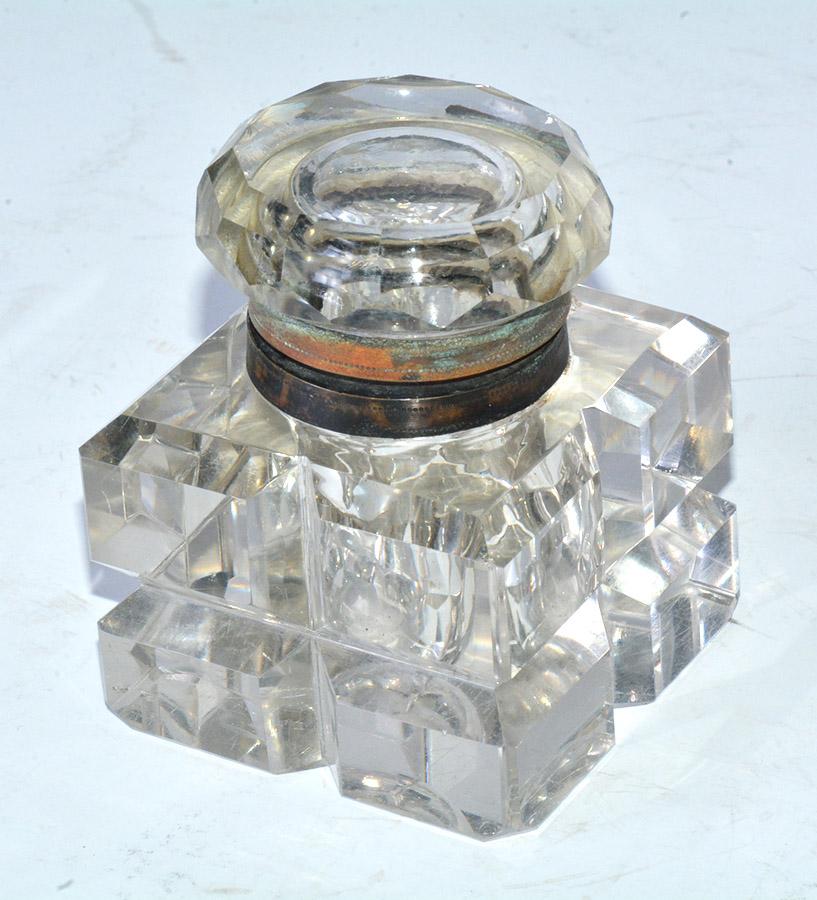 Elegant late 19th century crystal inkwell from England. square design with lovely chamfered edges and brass collar. Wonderful for any desk or table.
ink well, 