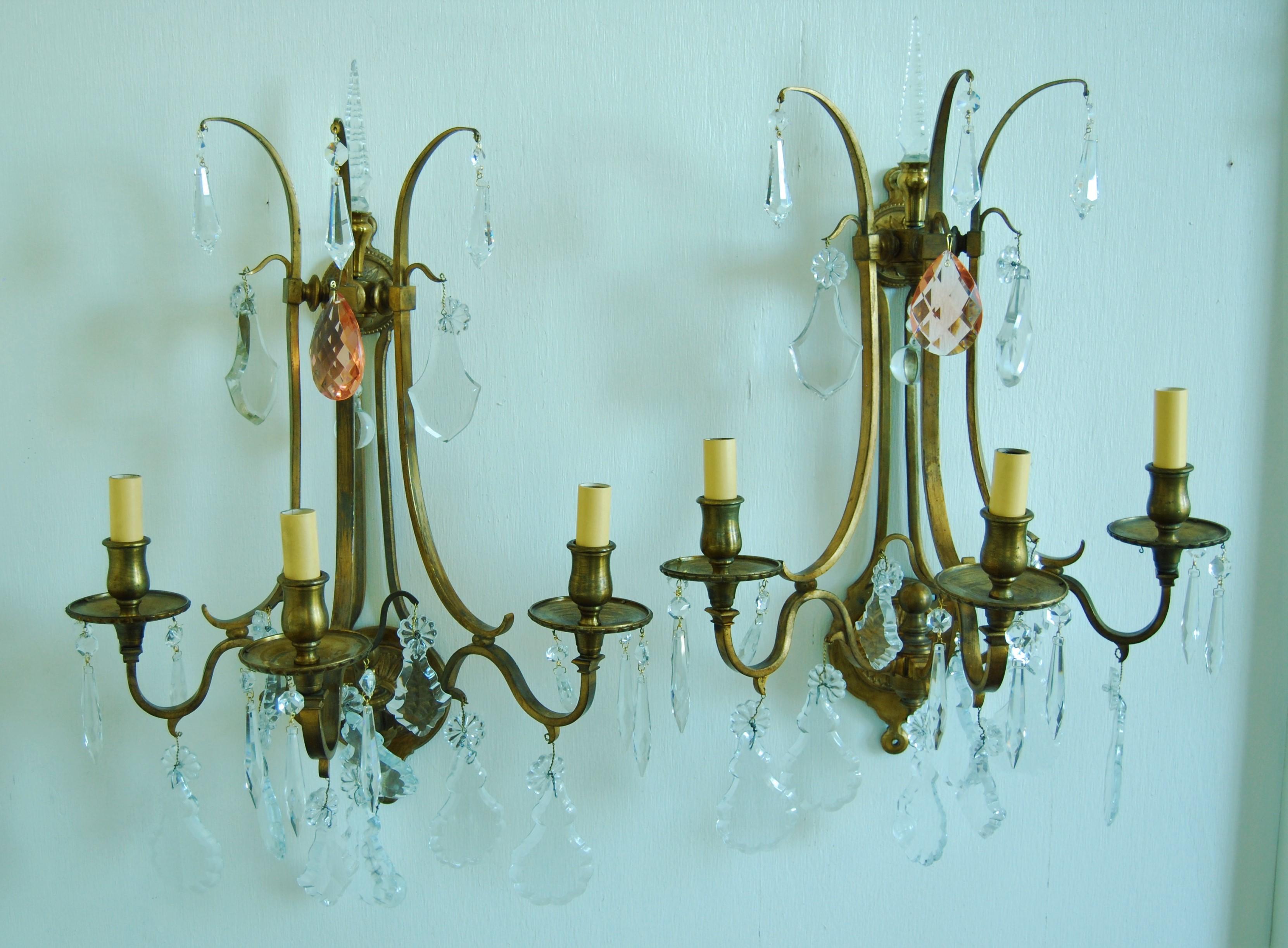 Pair of crystal sconces with new set of crystals. Great looking all finished on the wall. Good size. Doré gold finish.