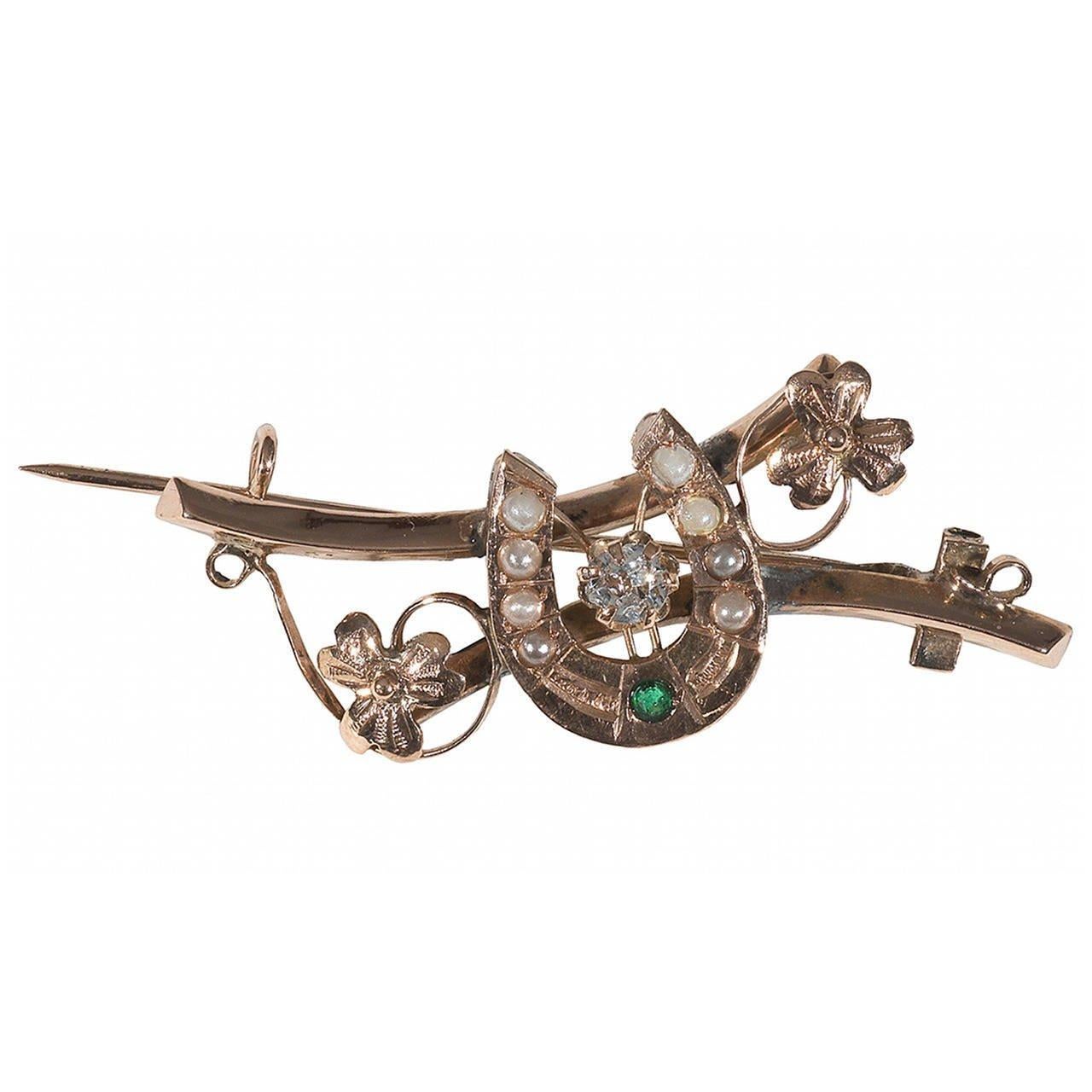 
Designed with an horseshoe centered by an crystal and decorated with an tourmaline and pearls, two flowers at the sides.

Mounted in yellow gold

42 mm long