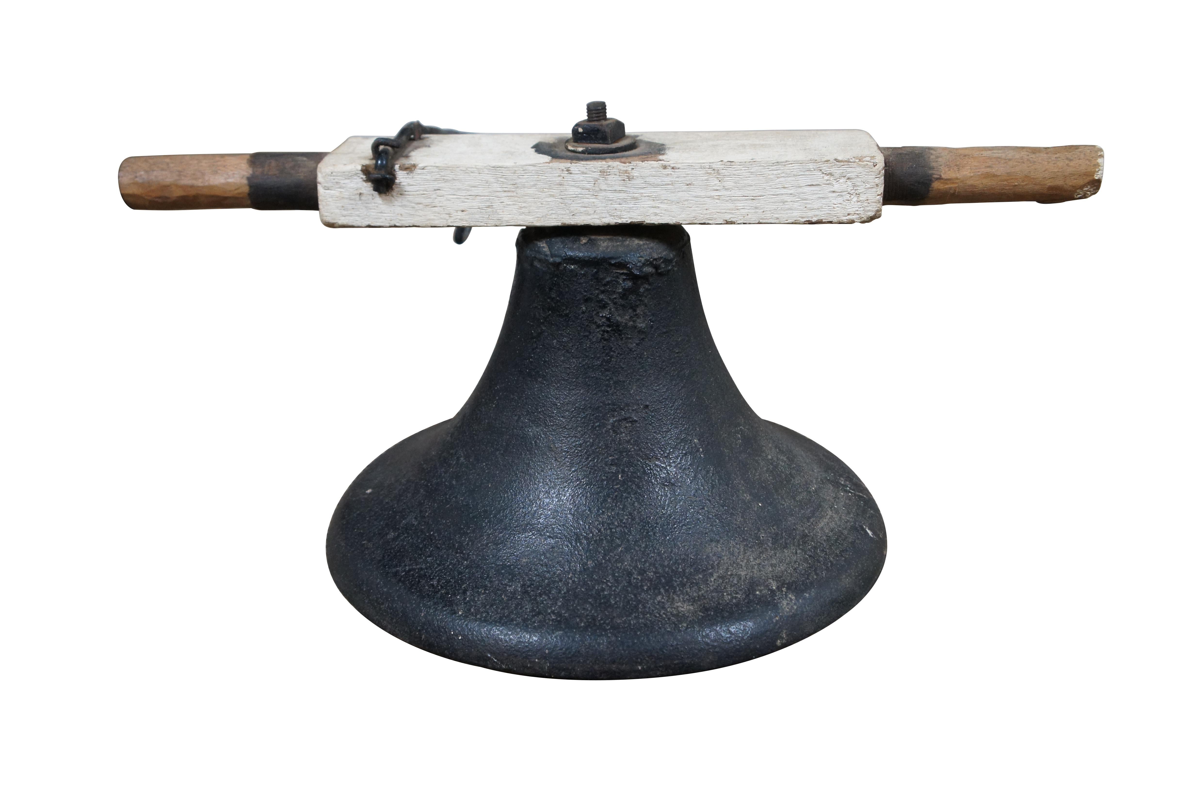A large and heavy antique cast iron swinging farm / church / school / factory / dinner bell and yoke, attributed to CS Bell Co, marked Crystal Metal No 2.

Bells were invented in 400 A.D. by Bishop Paulinus of Compagnia. They were not used in