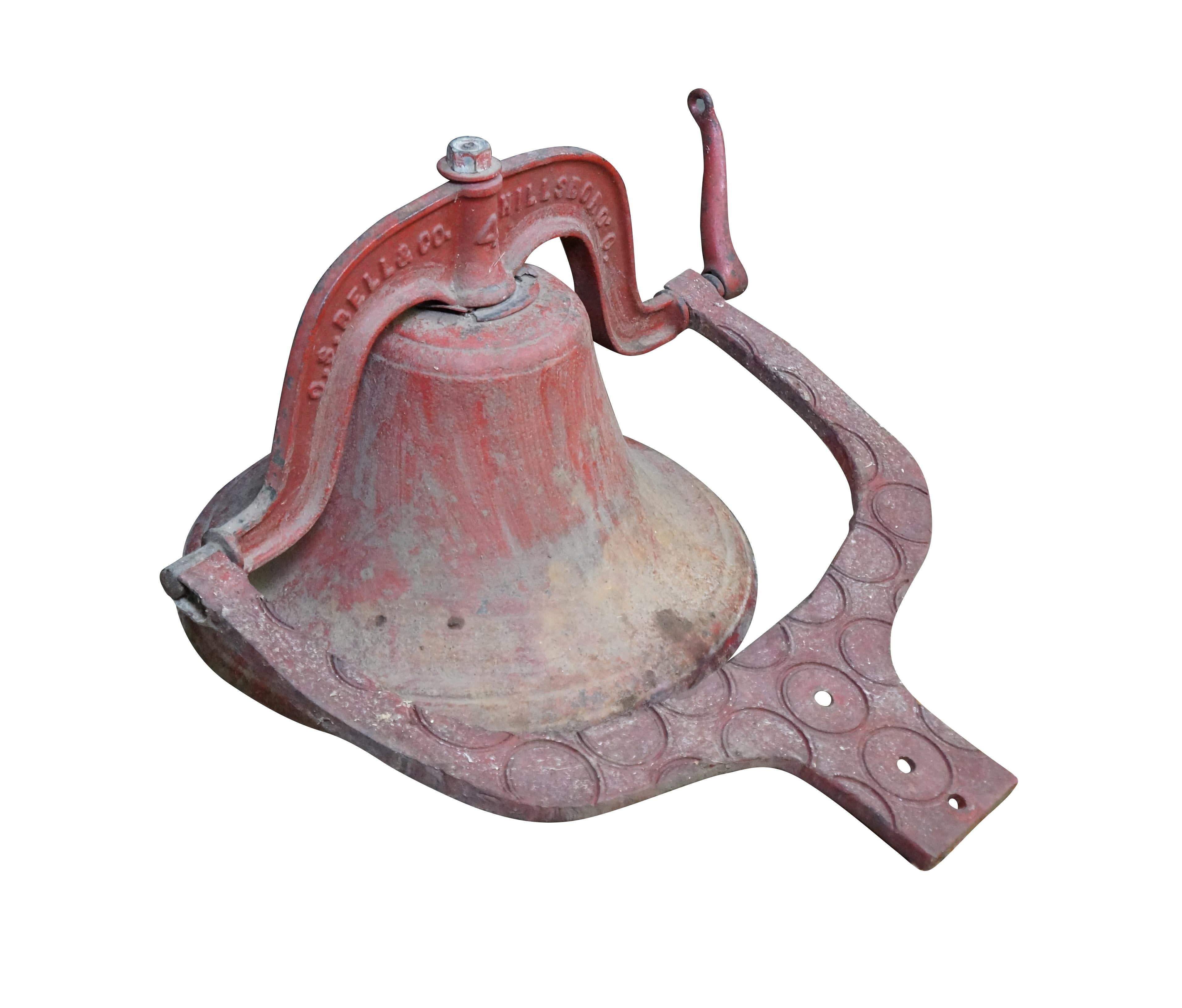 Late 19th century C.S. Bell & Company number 4 postmount farm / schoolhouse bell. Produced 1882-1894. Very large and heavy cast iron construction with red painted finish, bulb shaped clapper, and unique pressed circle pattern on