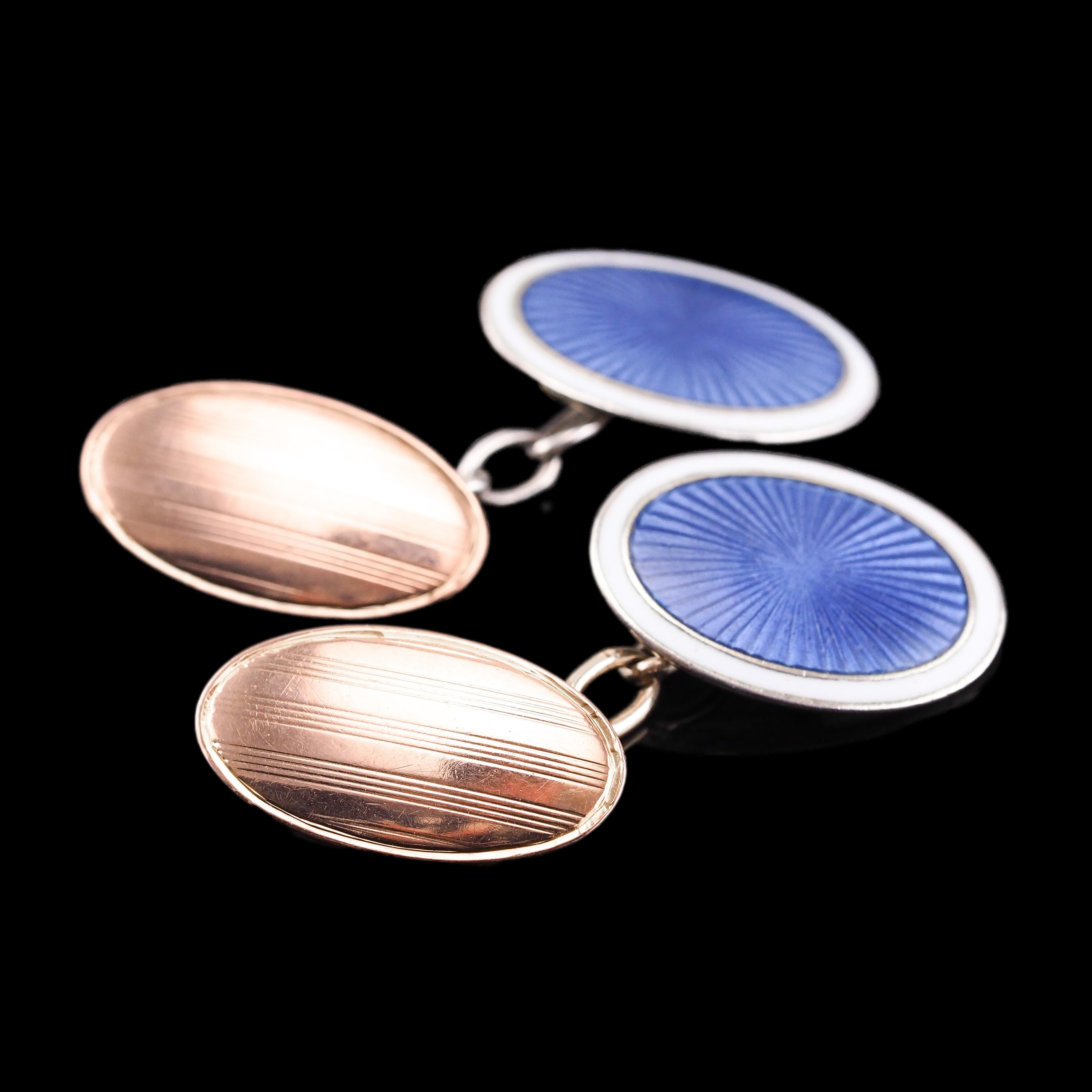 We are delighted to offer this marvellous pair of antique gold and silver cufflinks with a wonderful combined design of a rose gold panel and silver-blue sunburst guilloche enamel.

The rose gold portion features a modest yet elegant reeded stripe