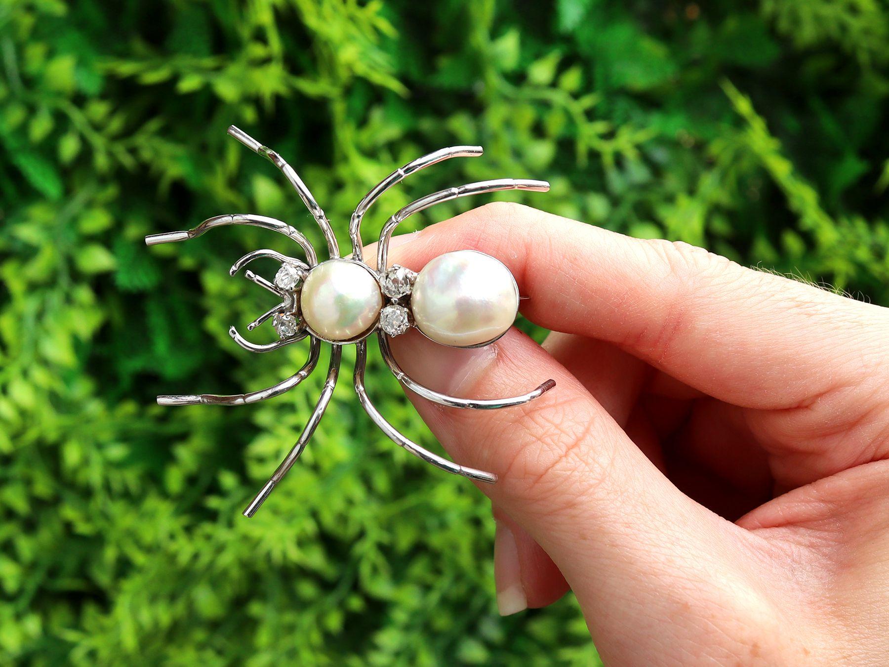 A stunning, fine and impressive cultured pearl and 0.52 carat diamond, 18 karat white gold spider brooch; part of our diverse range of antique gemstone jewellery/jewelry.

This stunning, fine and impressive antique brooch has been crafted in 18k