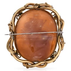 Antique Cupids Creating Art Cameo with Ornate Vines Frame Brooch