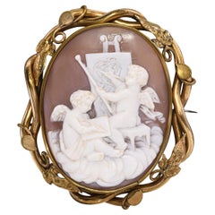 Antique Cupids Creating Art Cameo with Ornate Vines Frame Brooch