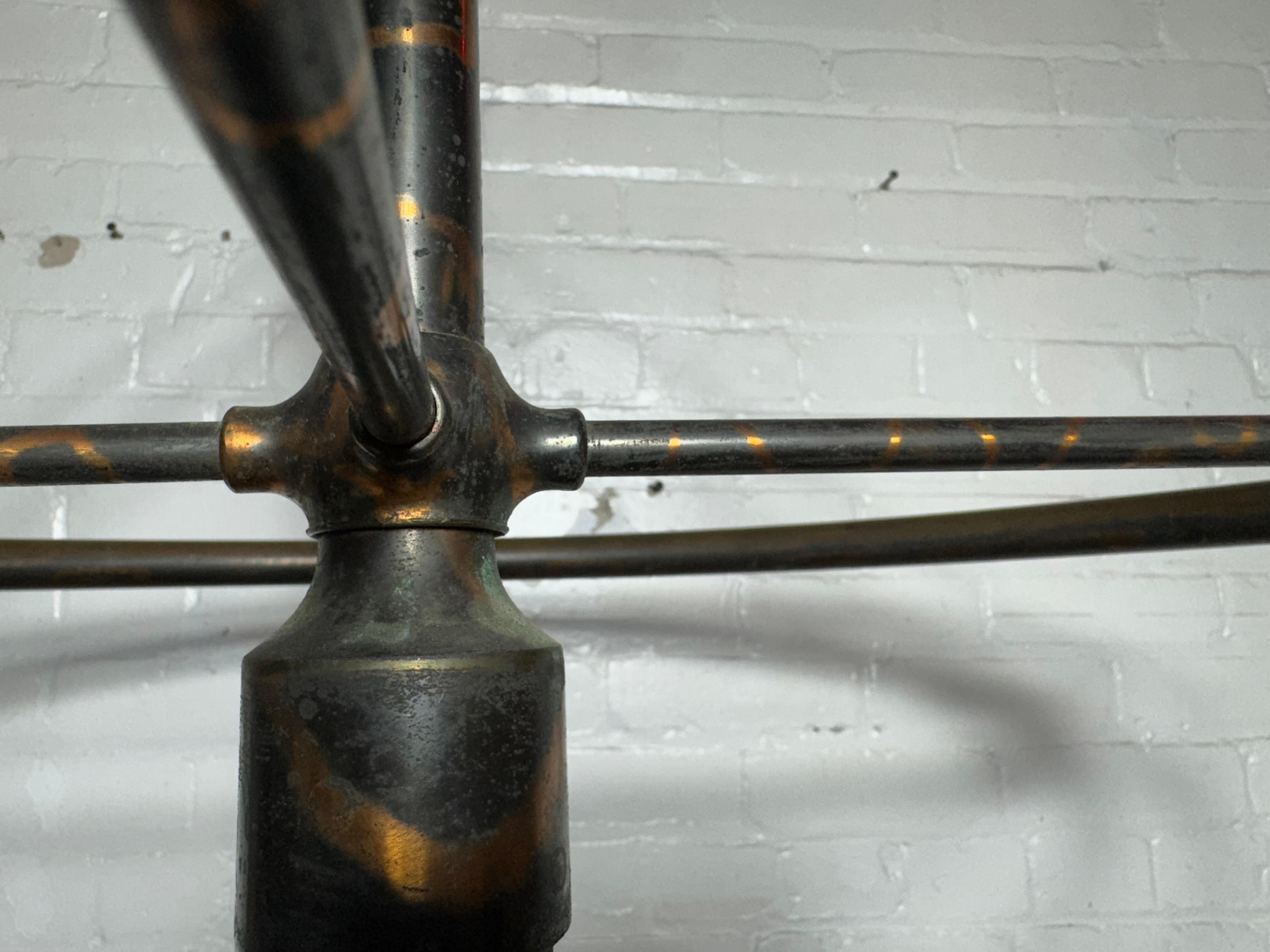 Antique Curtis Ledger Flashed Copper (JAPANED) Garment Rounder...  iron base measures 31” across. Still rolls well. Brass rounder measures 30” across. Overall height of 79.” Flashed copper (JAPANED) finish. Makers mark embossed on base and tagged on