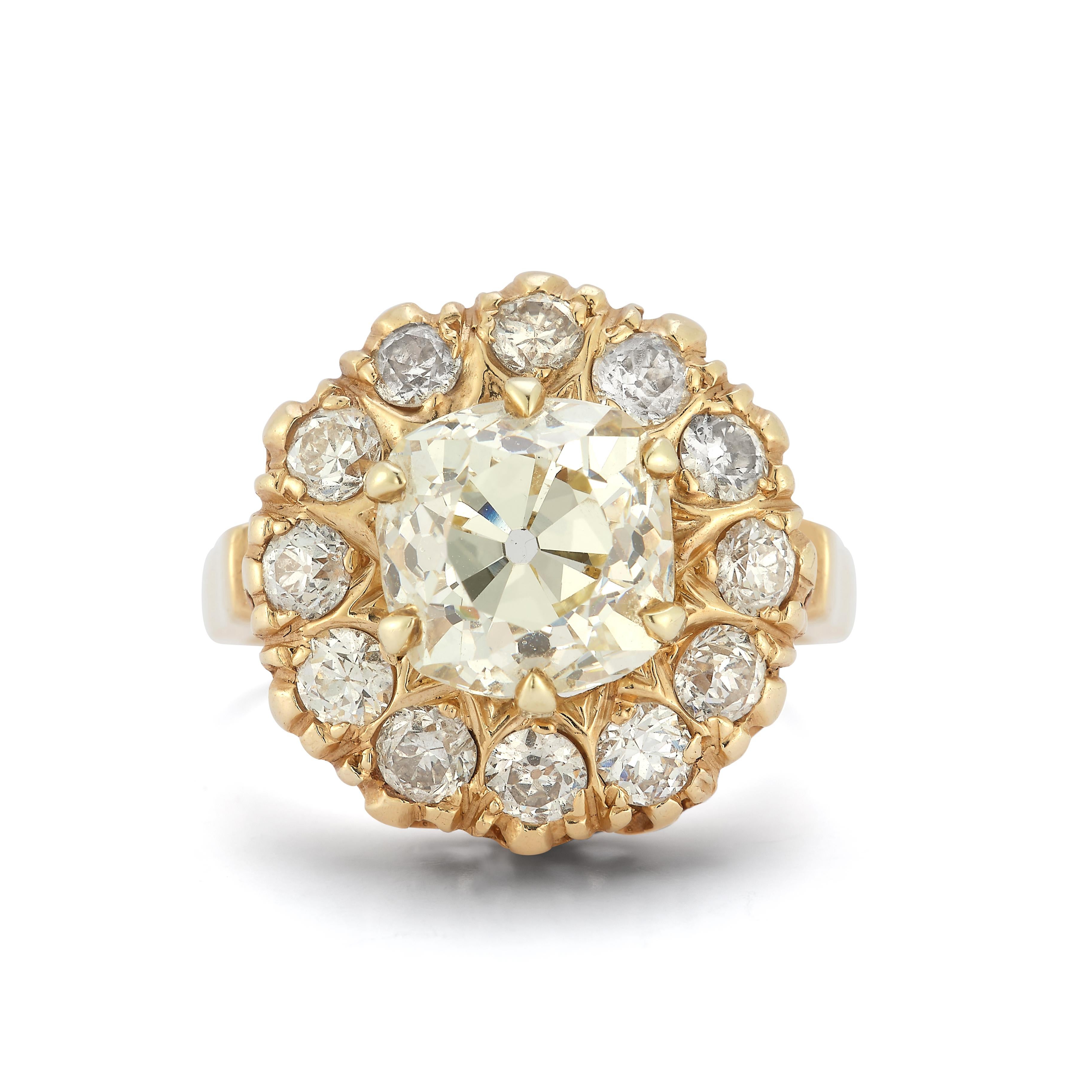 Vintage Cushion-Cut Diamond Halo Ring

A timeless treasure of vintage elegance, this vintage halo ring features a captivating cushion-cut diamond at its heart, radiating a warm and luminous glow. Encircled by a sparkling halo of round-cut diamonds,