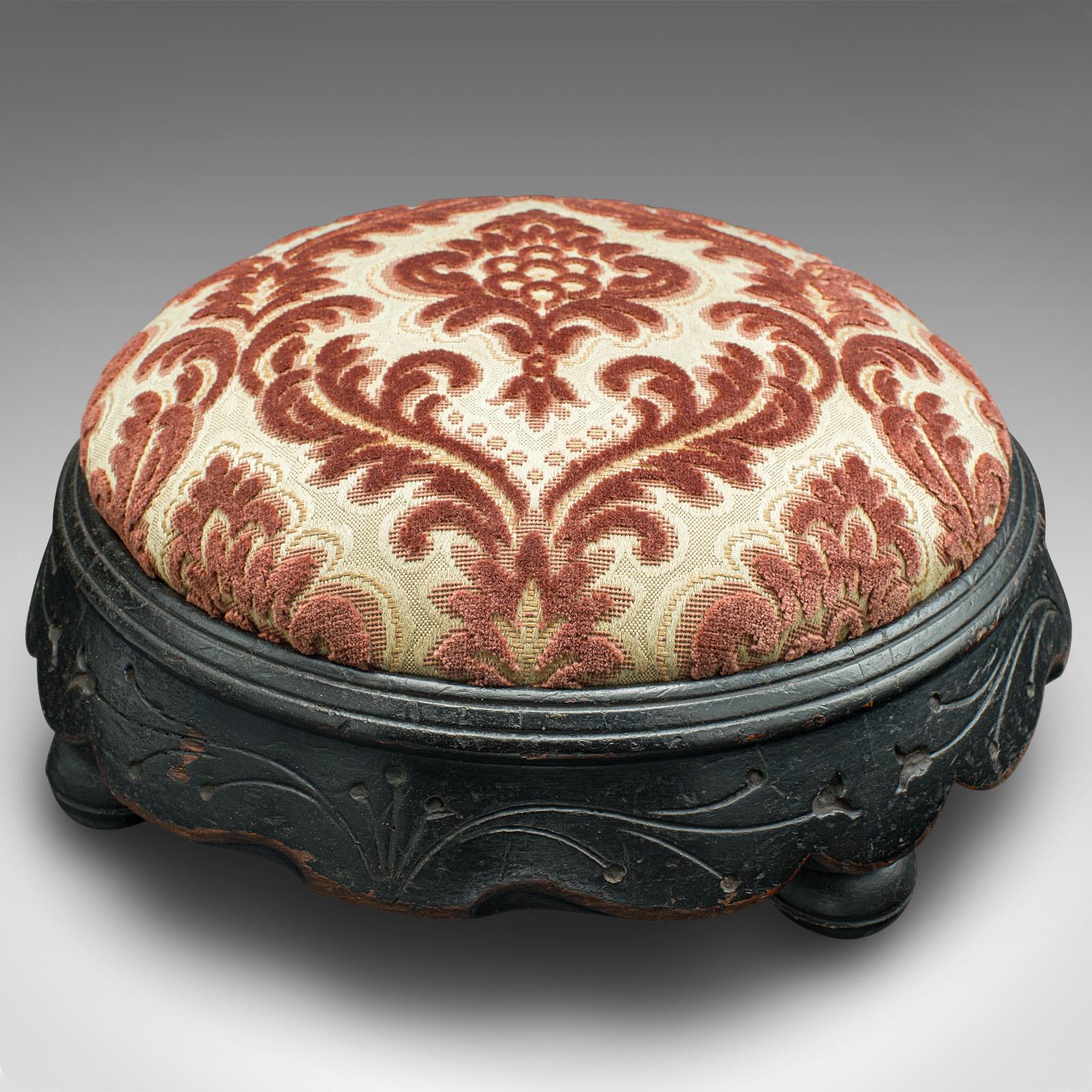 This is an antique cushioned stool. An English, ebonised mahogany footstool with Art Nouveau taste, dating to the late Victorian period, circa 1895.

Striking ebonised appearance with wonderfully padded cushion
Displays a desirable aged patina