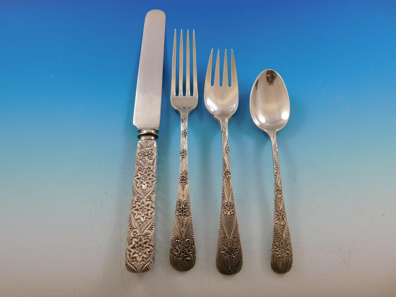 Exceedingly rare antique engraved aka custom engraved by Tiffany & Co. sterling silver flatware set with intricately hand engraved design, 79 pieces. This set includes:

12 knives, hollow handle with blunt blades, 9 3/8