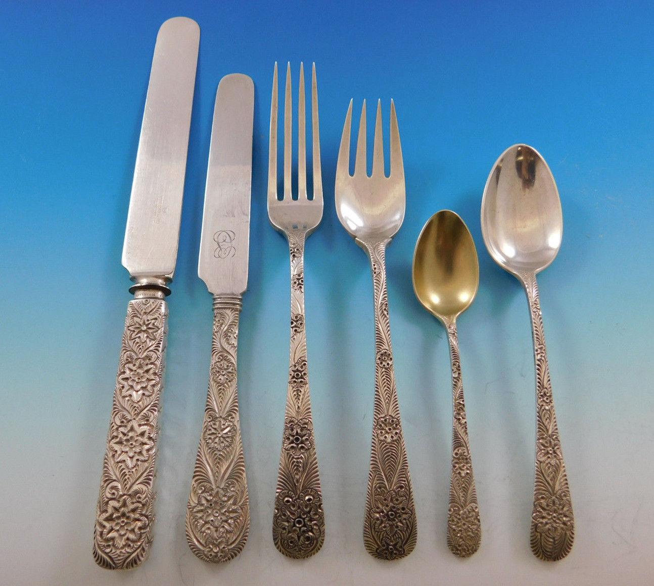 Exceedingly rare antique engraved aka custom engraved by Tiffany & Co. sterling silver flatware set with intricately hand engraved design, 80 pieces. This set includes:

12 knives, hollow handle with blunt blades, 9 3/8