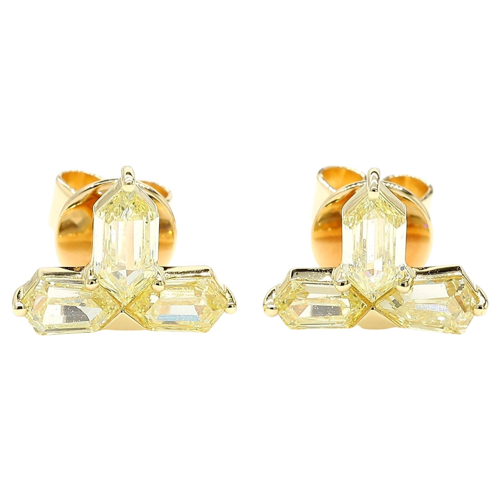 This fancy yellow antique pair of diamond earrings with six bullet cut yellow diamonds is testament to fine craftsmanship and timeless design. Perfect for those who appreciate the beauty of natural diamonds, these earrings offers a balance of luxury
