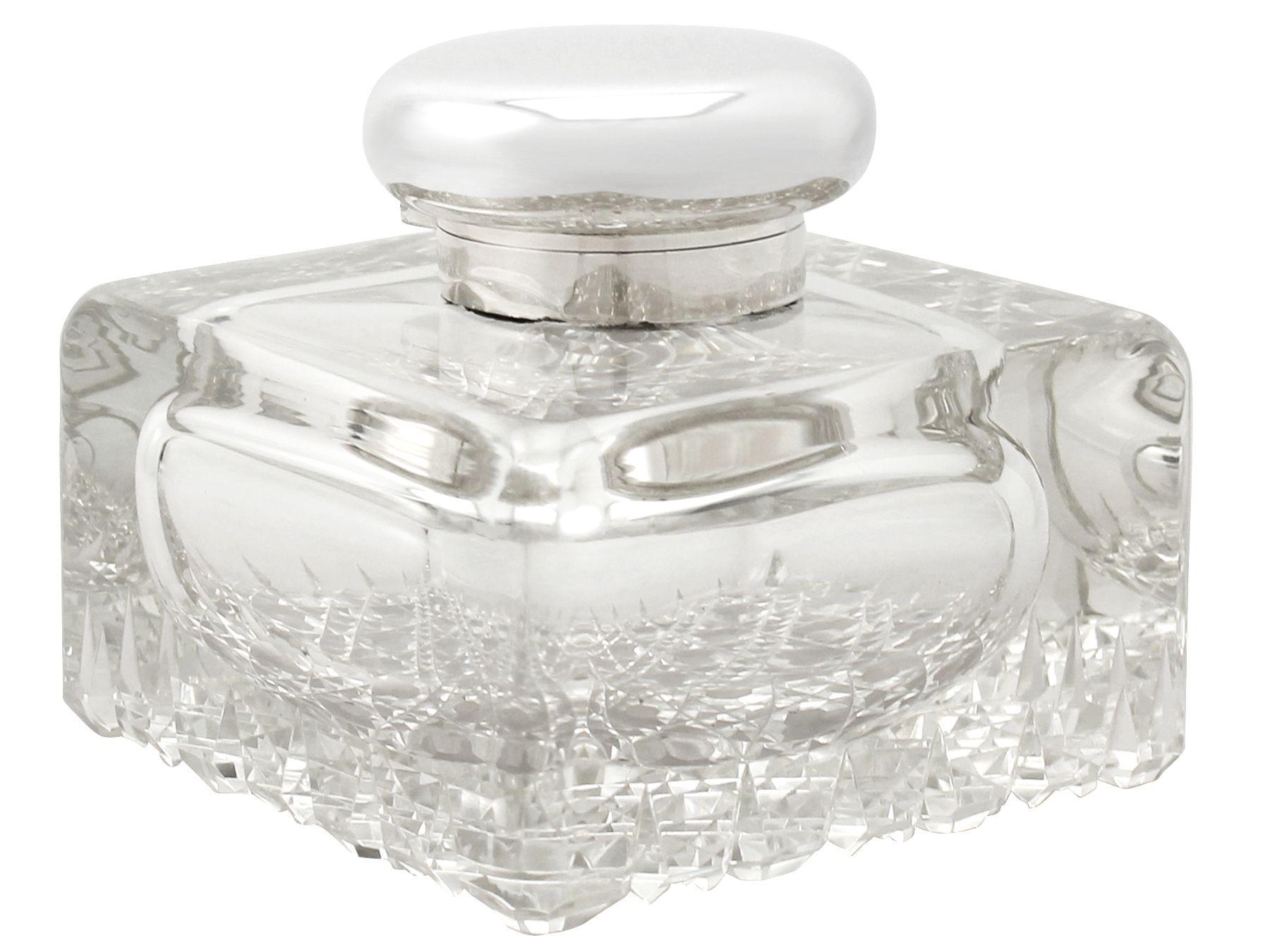 An exceptional, fine and impressive, large antique George V cut-glass and English sterling silver mounted desk inkwell made by Asprey & Co; part of our antique silver and glassware collection.

This fine antique George V cut glass and English