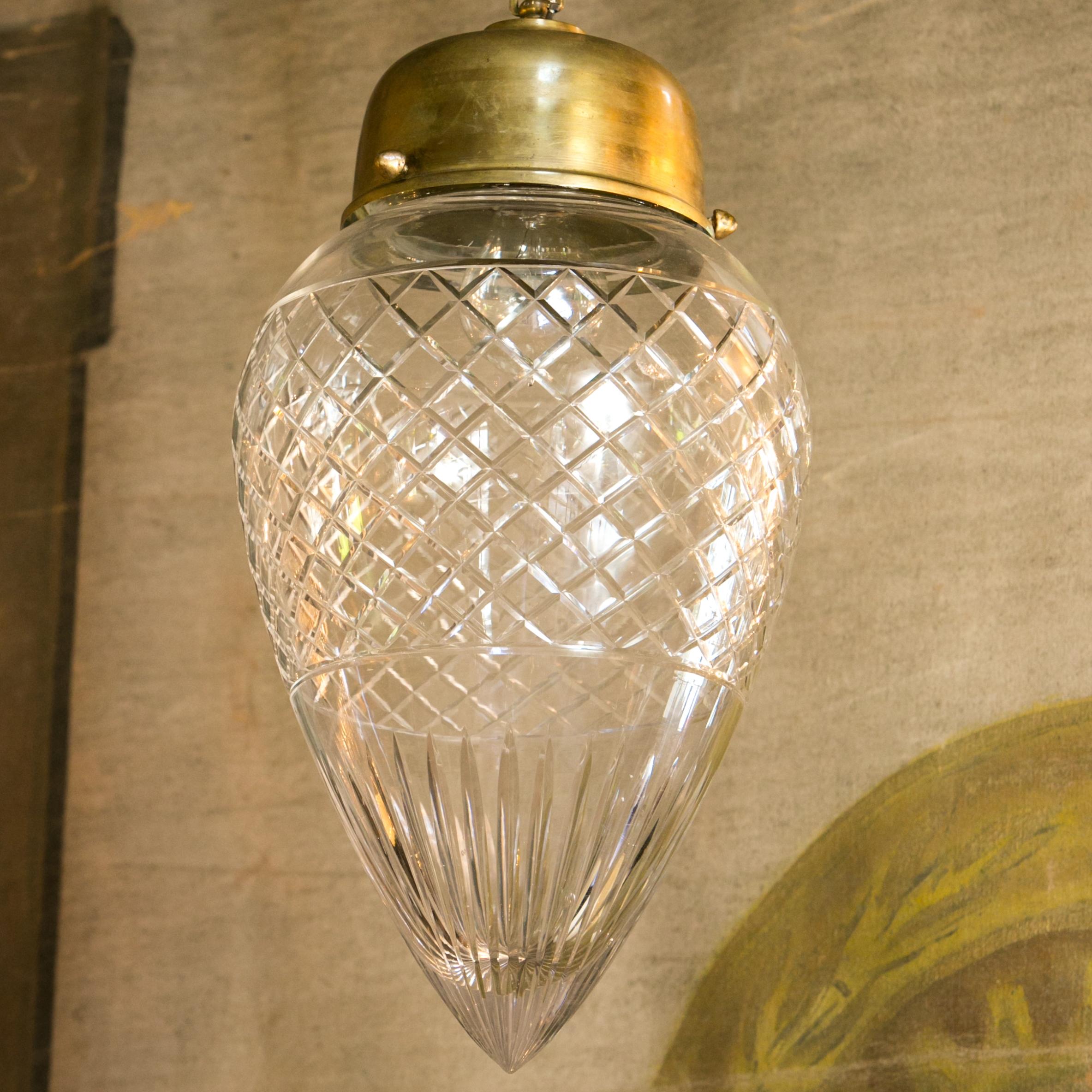 Antique cut-glass pendant, or flush mount, light with burnished brass hardware. This light is both simple, classic and a bit dressy at the same time. The chunky top is proportioned in an interesting, unusual fashion. The burnished finish on its