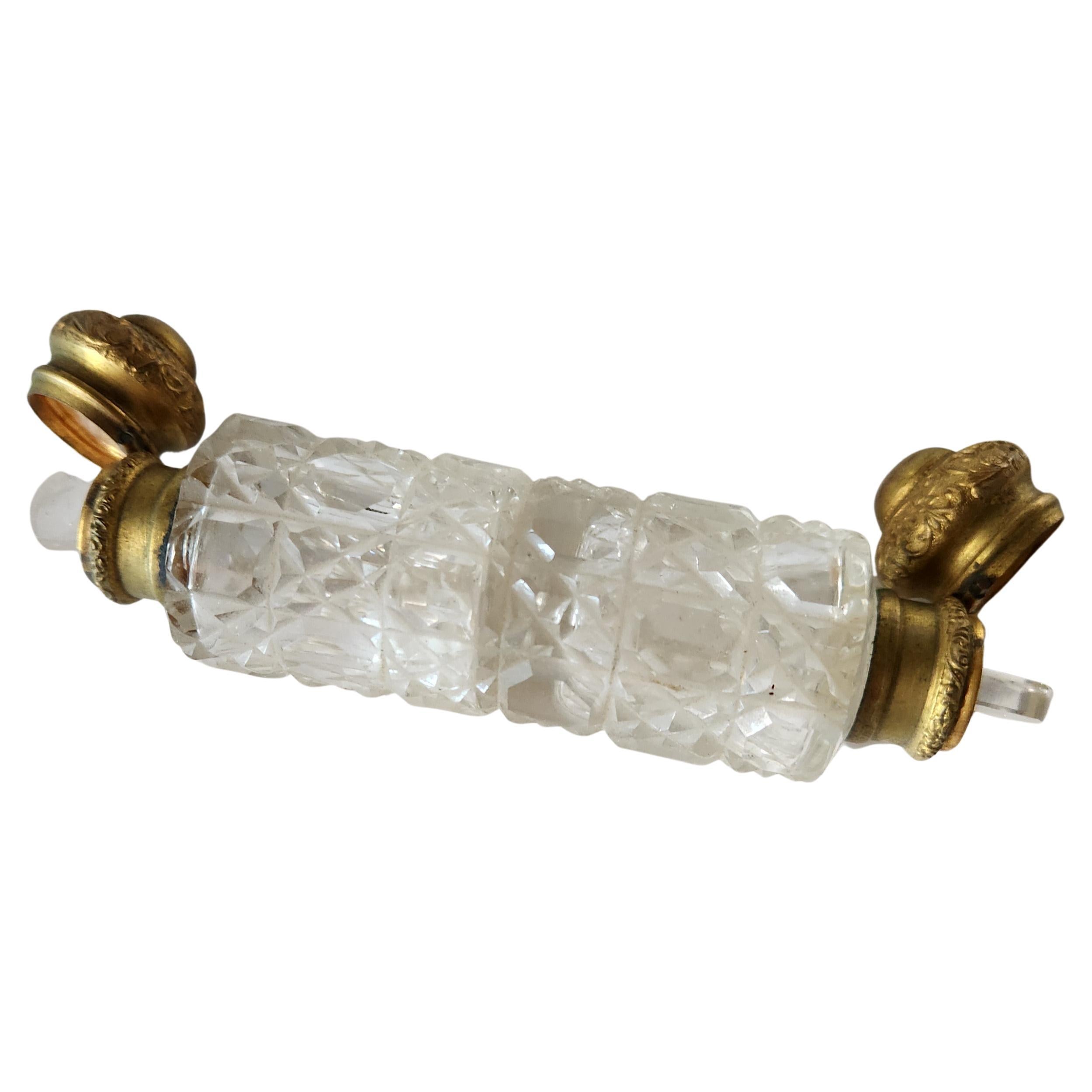 AMBIANIC presents
Antique Cut Glass Perfume Scent Bottle Double Ended
Preowned vintage unrestored
Double ended with 2 stoppers
Cut glass and brass ends with embellishments
5 inches tall x 1.13 diameter
